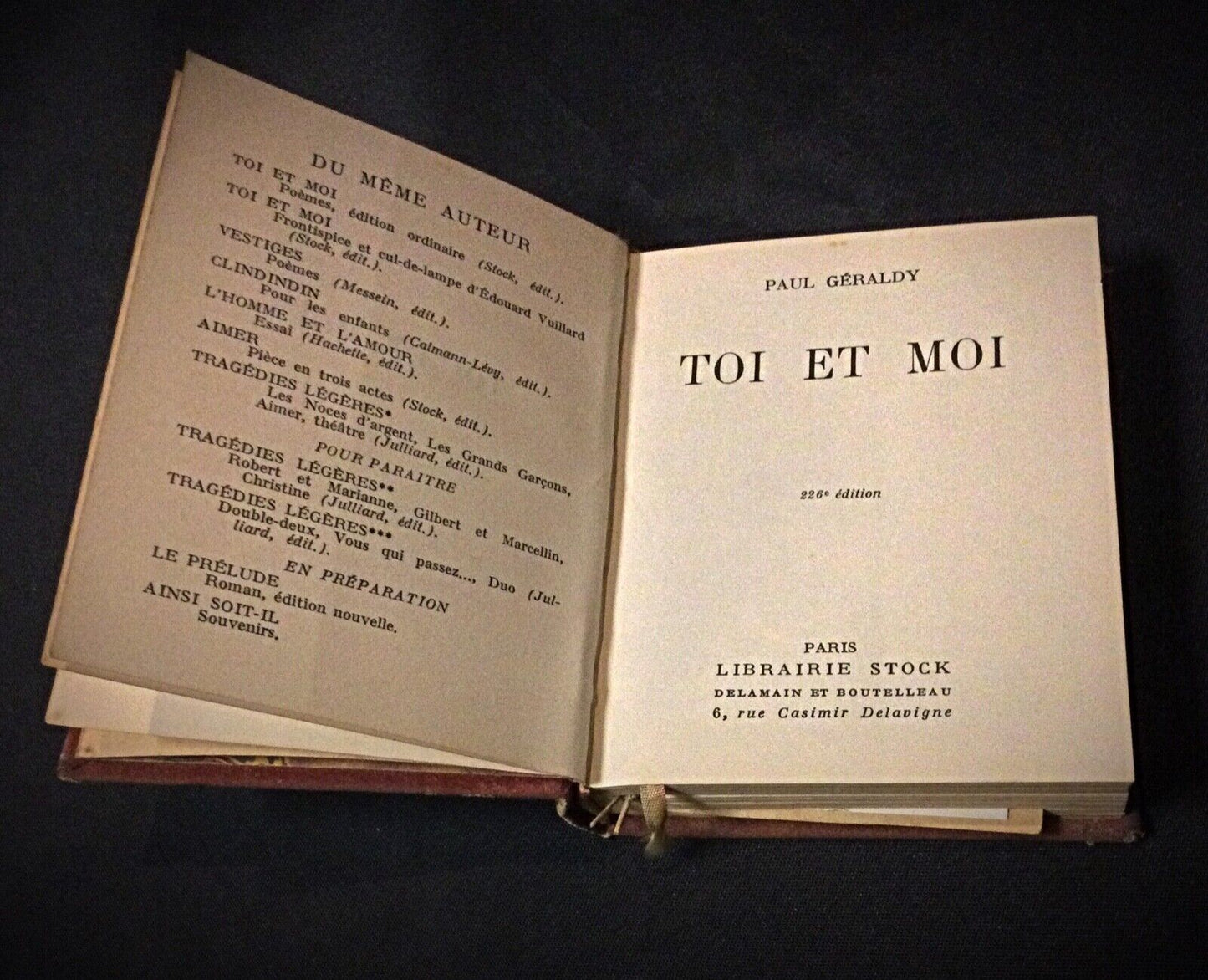A close-up of the book spine, showing its vintage condition