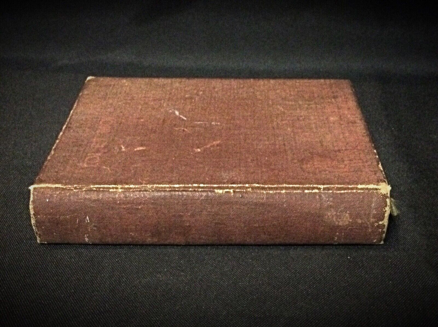 A side view of the book, showing its compact size