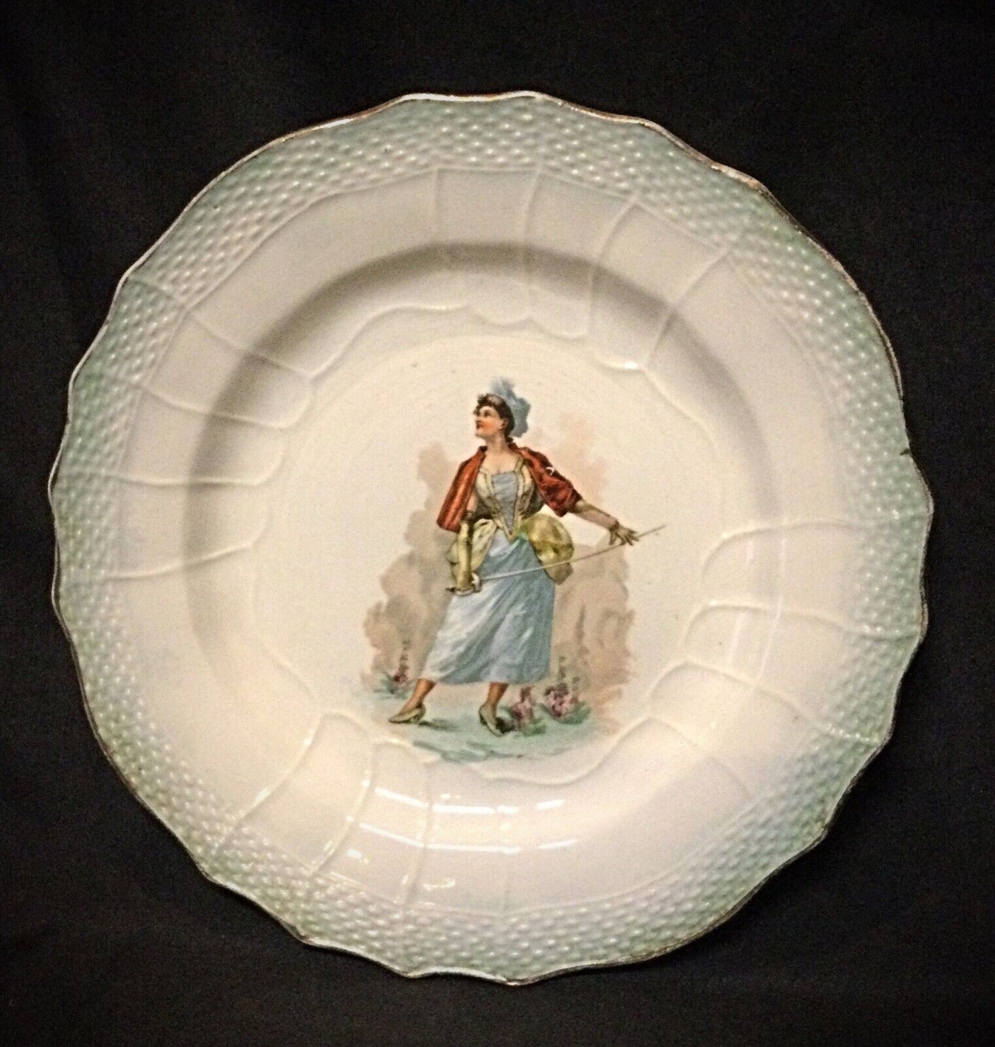 Close-up of the signature on the back of this vintage faience plate
