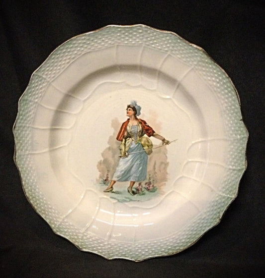 Close-up of the signature on the back of this vintage faience plate