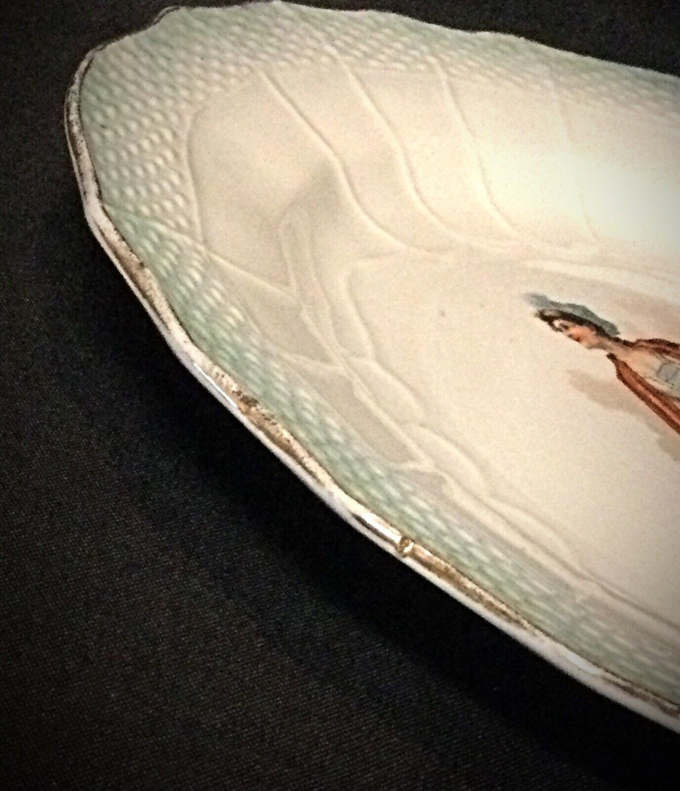 A side angle view, highlighting the plate’s curved edges and glossy finish