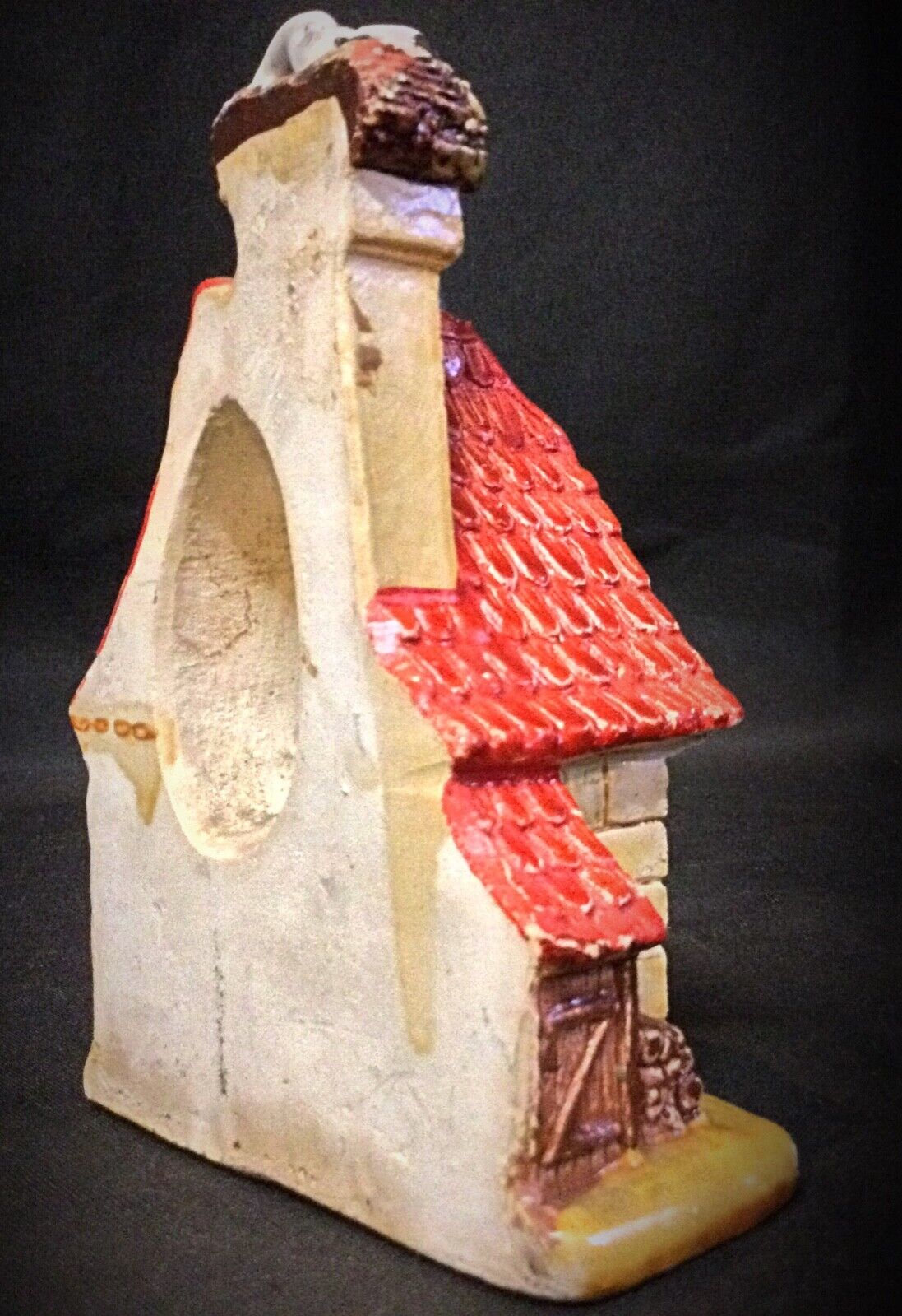 Side profile of the vintage plaster house with aged patina