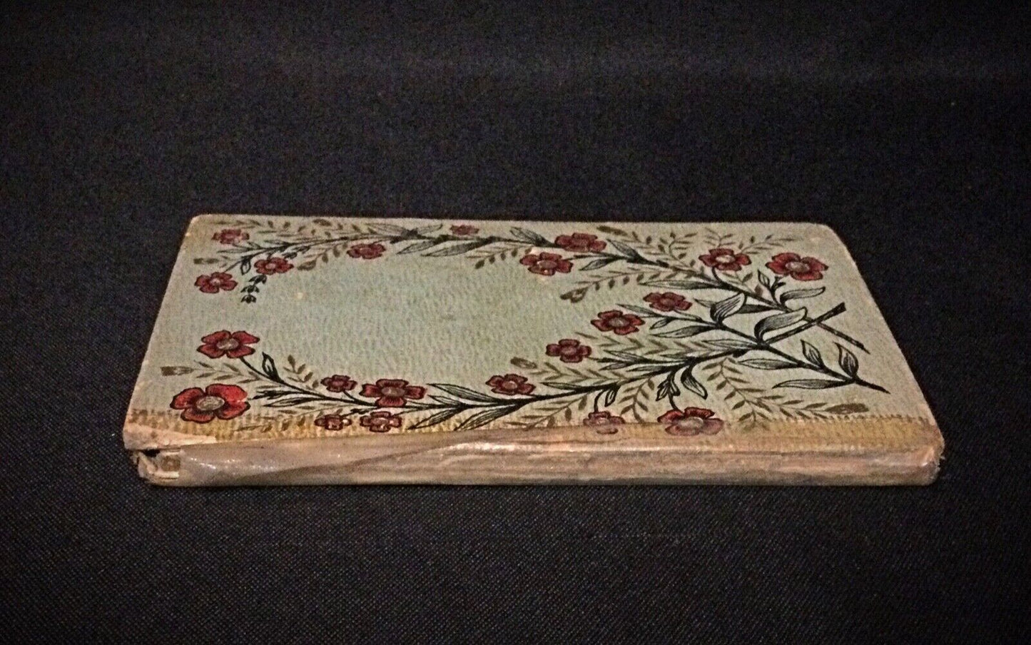 Close-up of the cover of "La Joie de Vivre" showing its good condition with writing on the first page