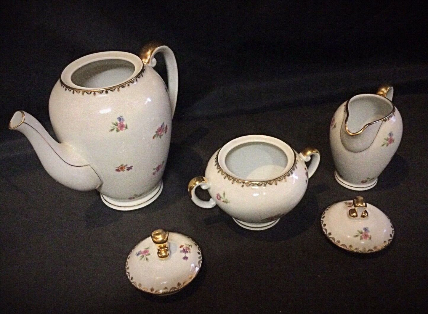 French porcelain pitcher with a smooth finish and elegant handle design