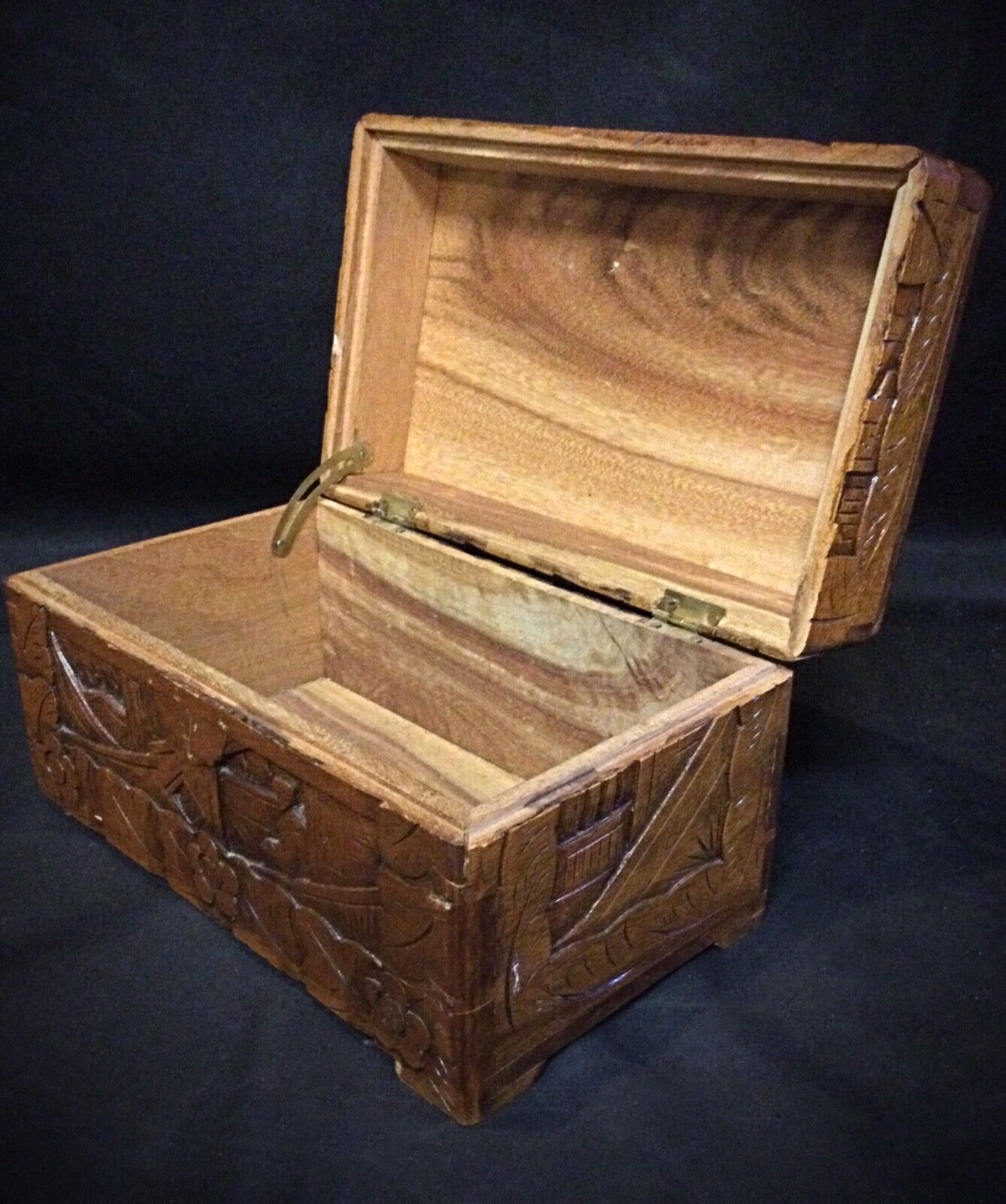 Beautifully crafted wooden jewelry box with artistic carving