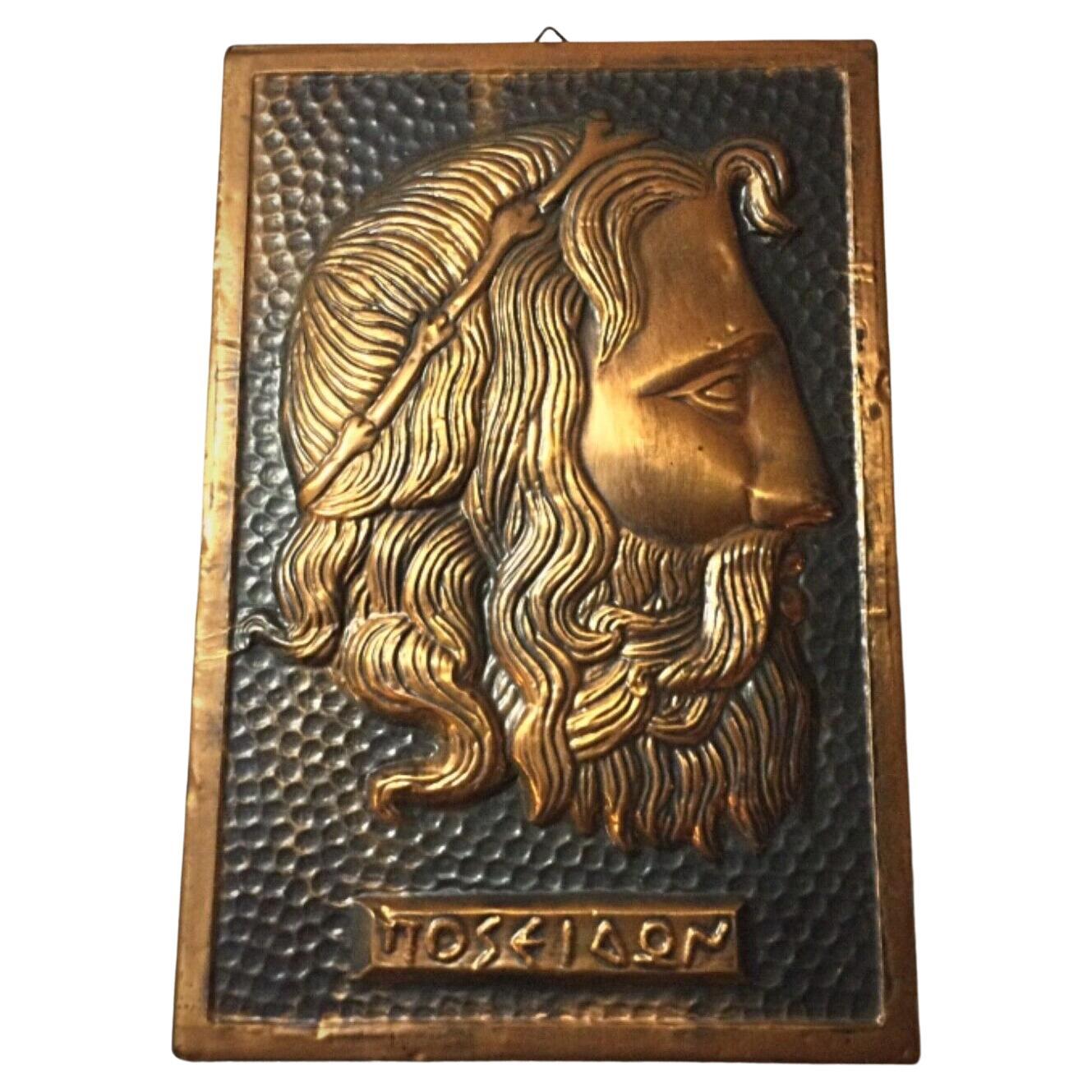 Vintage hammered copper bas-relief of Poseidon's head
