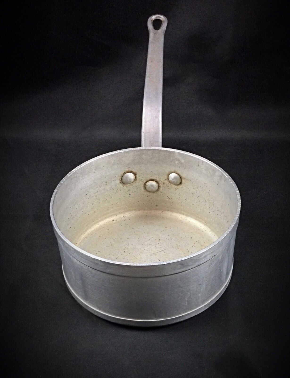 Heavy-duty aluminum saucepan perfect for cooking and collecting