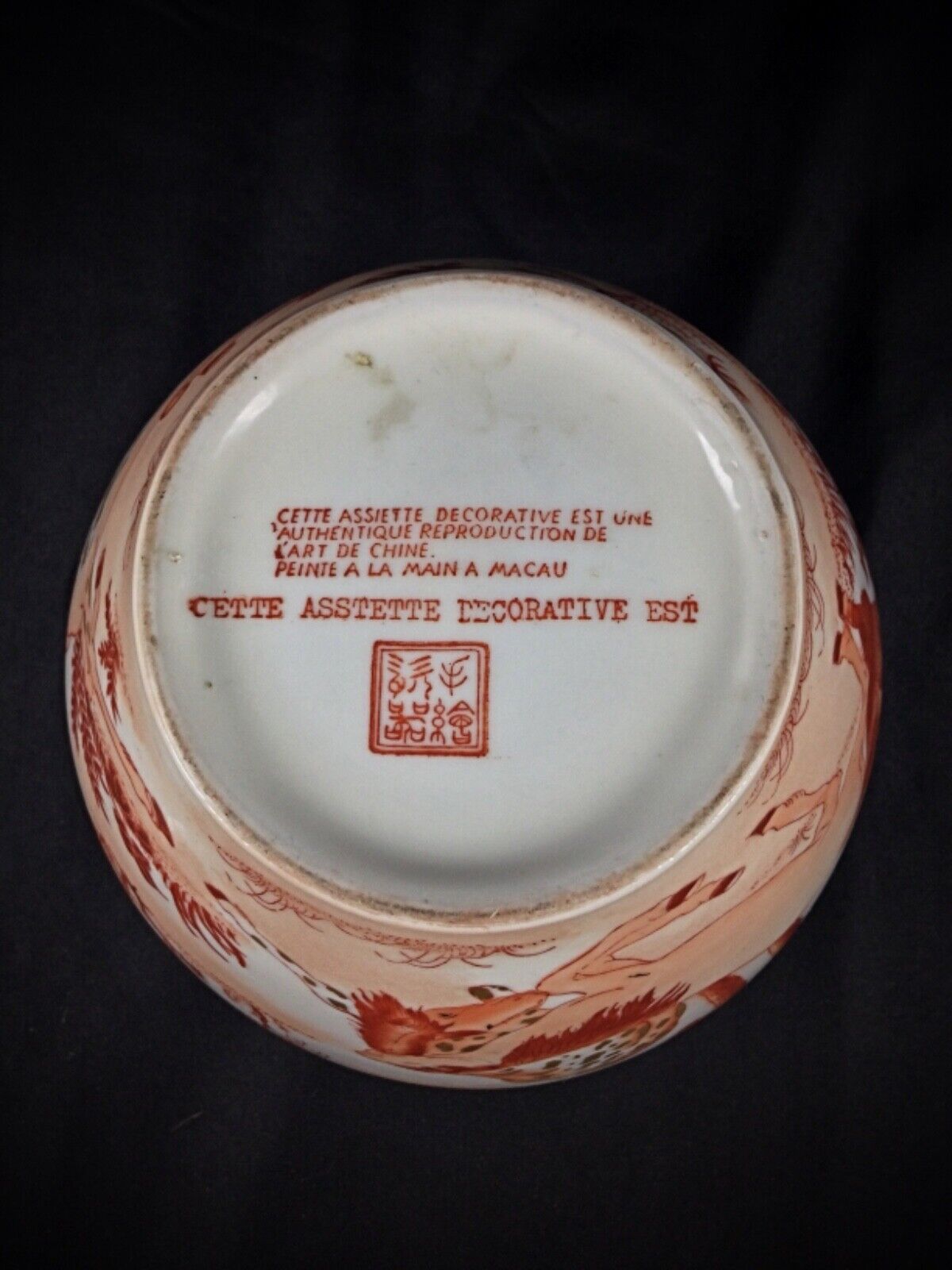 Detailed view of gilded floral patterns on Chinese vase