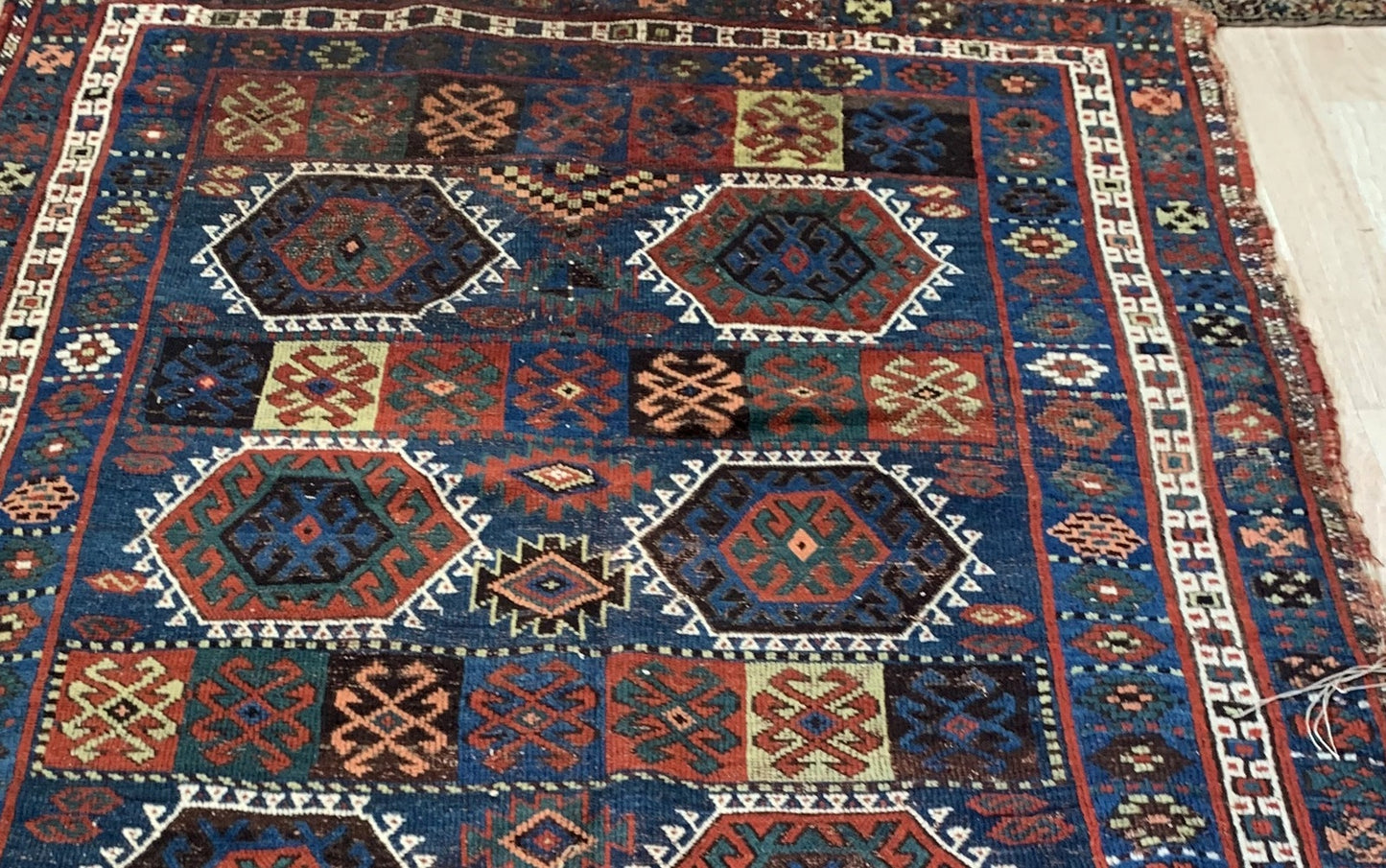 Close-up of a patterned rug with geometric designs.