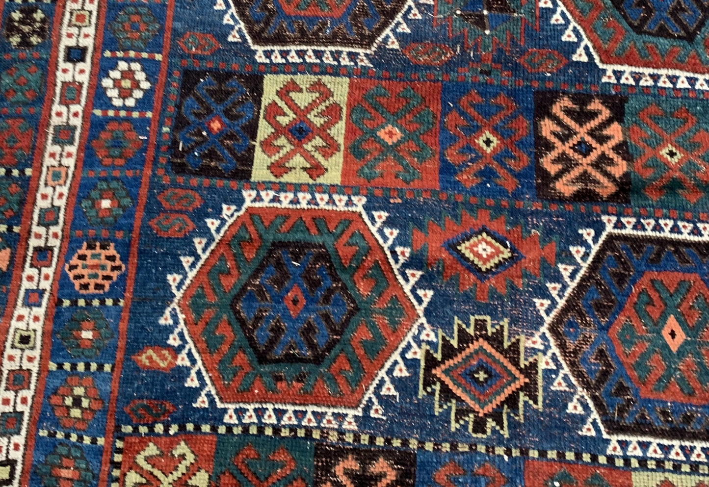 Terracotta and cream accents in Persian tribal rug