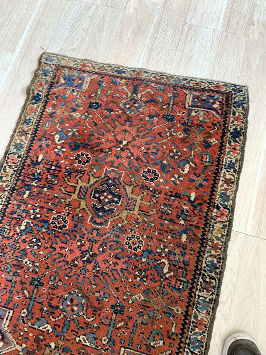 1910s handmade Karajeh rug with geometric medallions