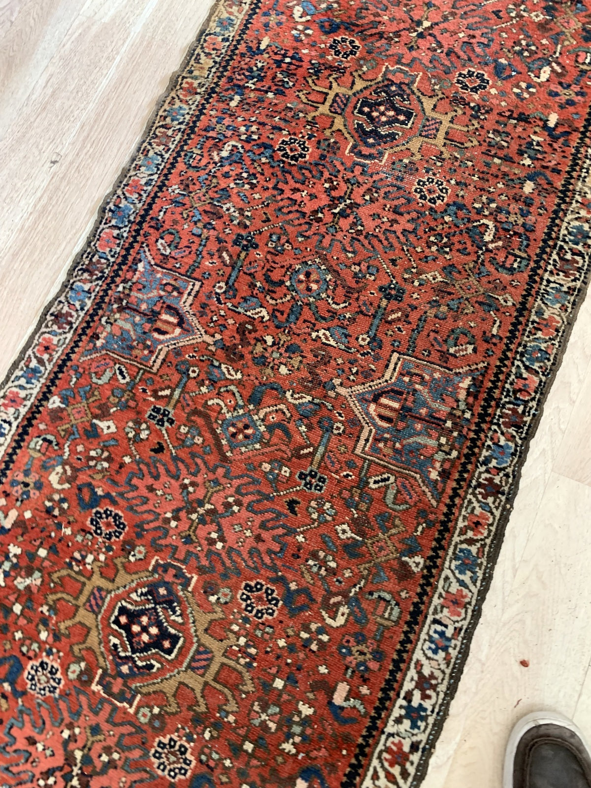 close-up of repeating stepped star patterns in Karajeh rug
