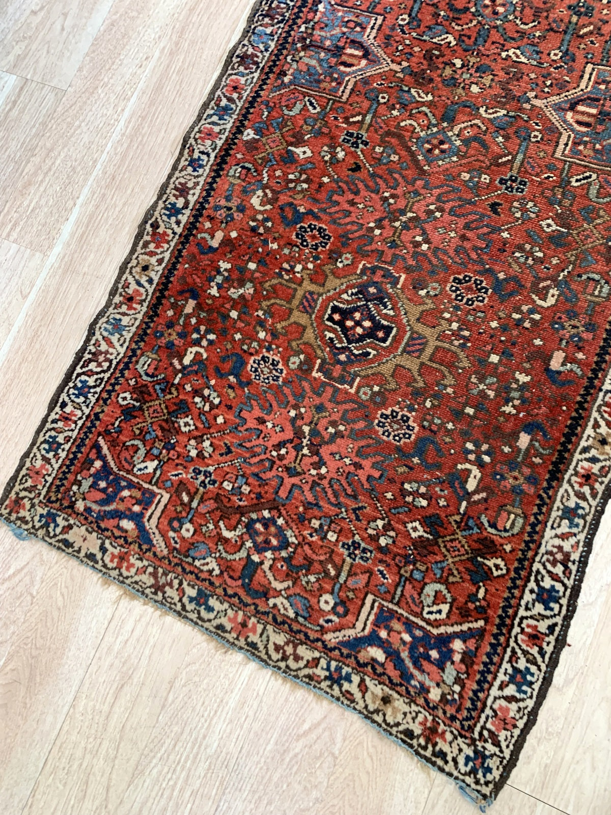 Persian tribal rug with bold red and blue color palette