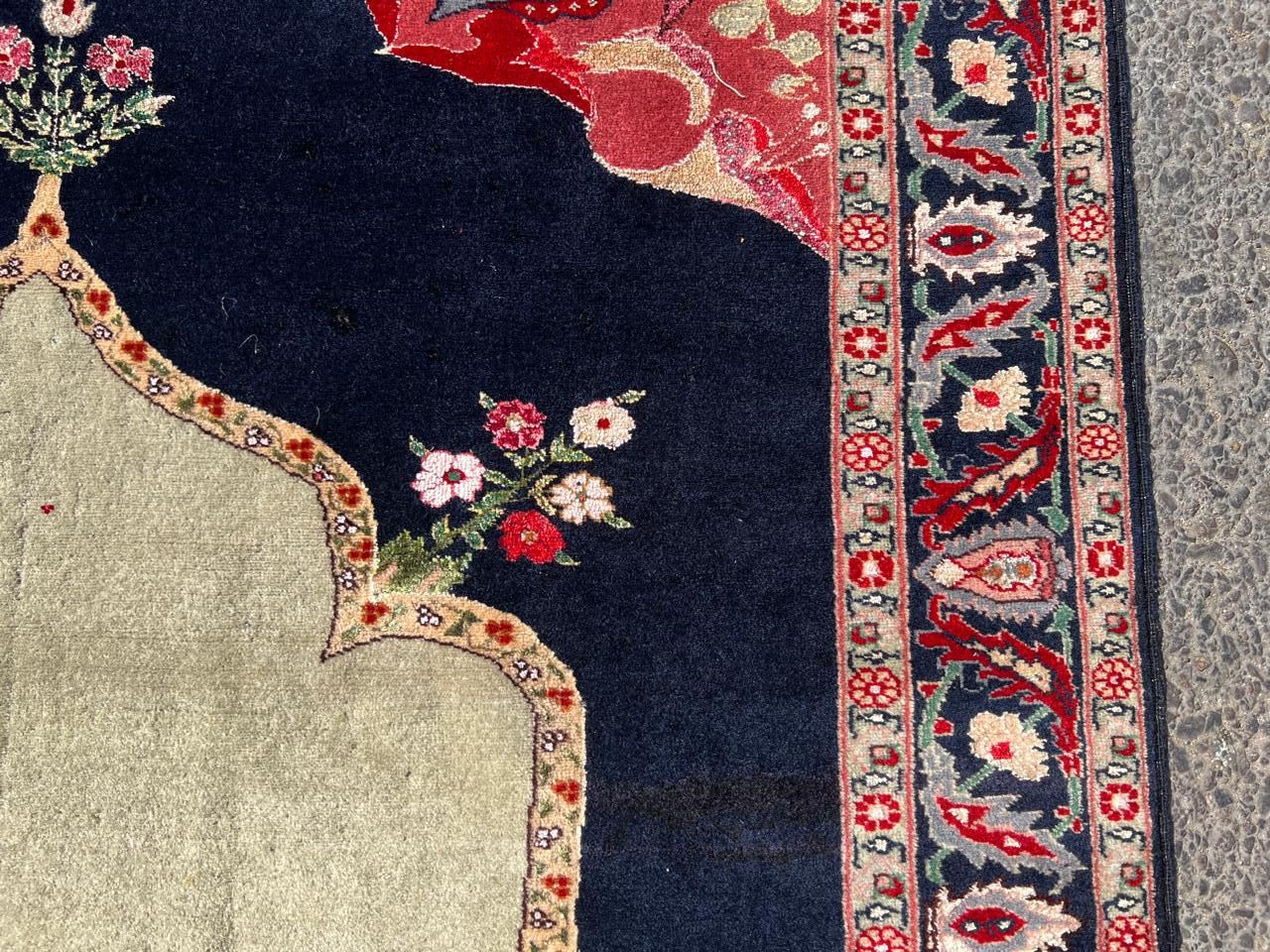 Detailed floral spray woven with wool and silk threads