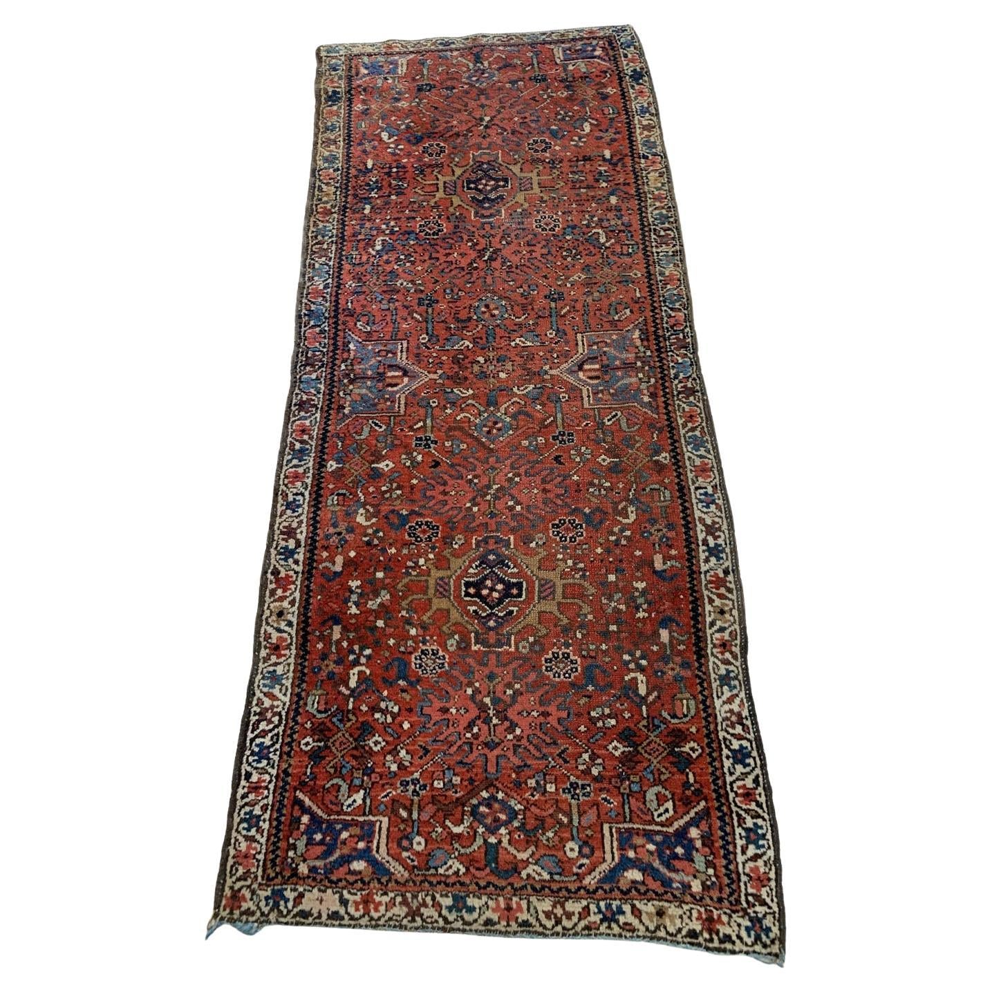 antique Persian Karajeh rug with red field and tribal motifs