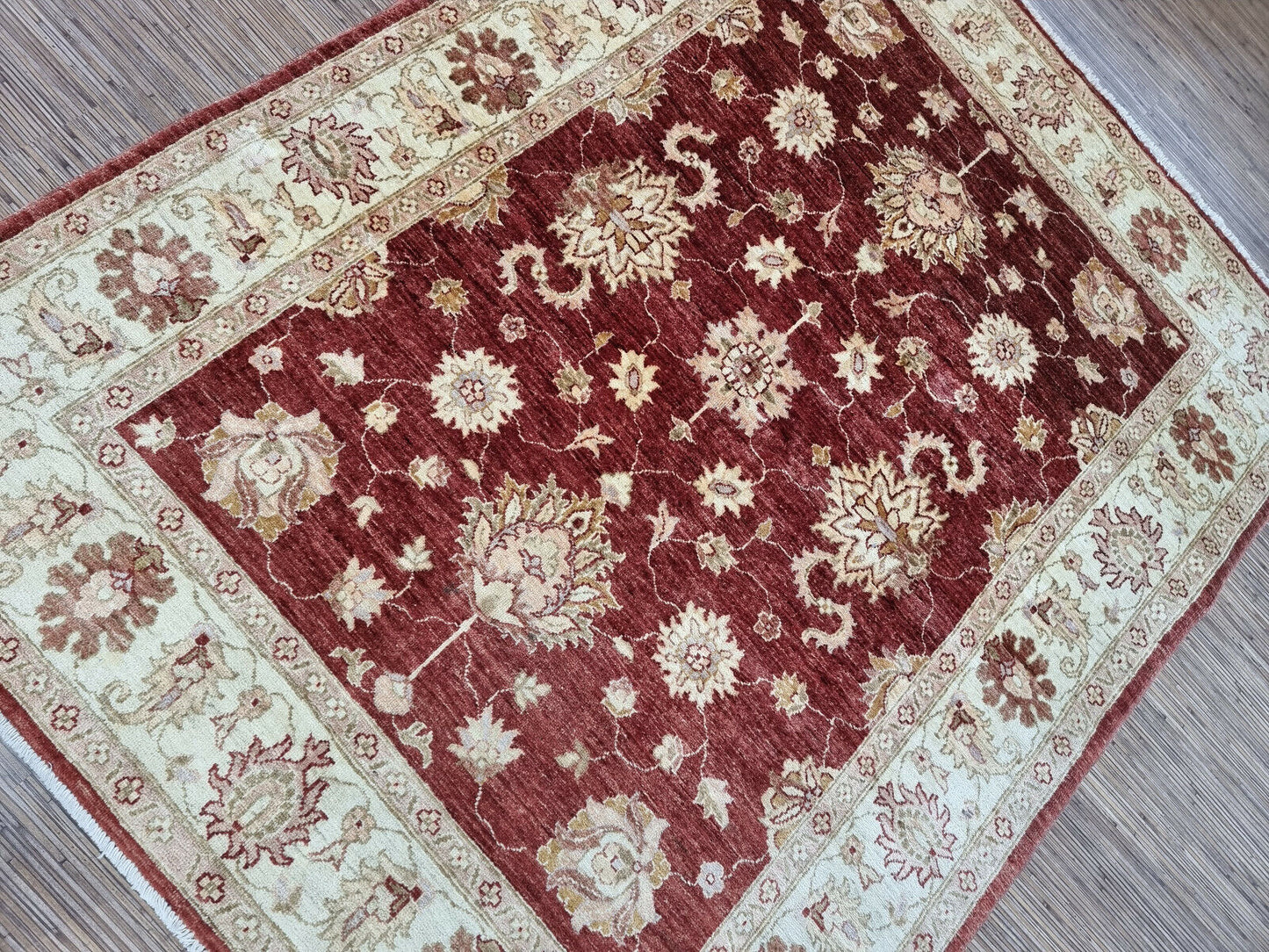 Close-up of cozy and inviting texture on Handmade Vintage Afghan Zigler Rug - Detailed view showcasing the cozy and inviting texture of the rug.