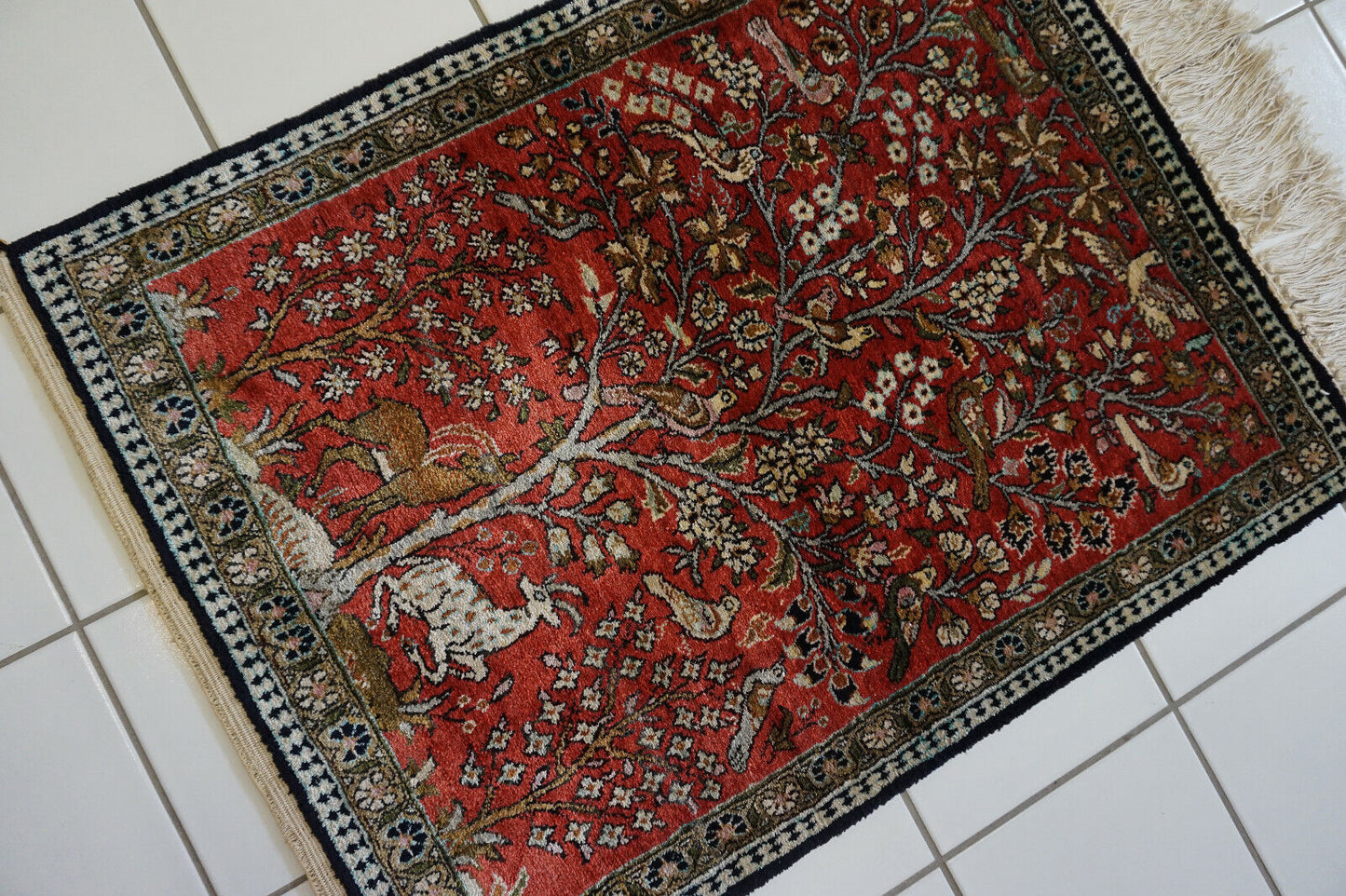 Detailed view of the fine silk weave and luxurious texture of the rug