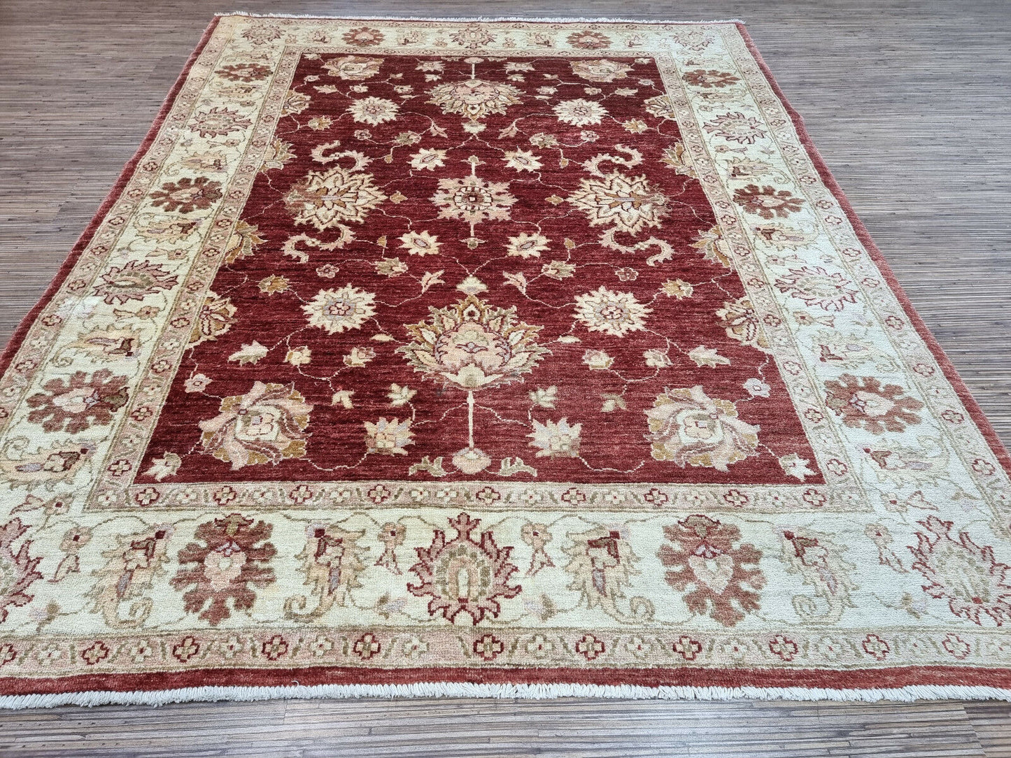 Close-up of 1980s craftsmanship on Handmade Vintage Afghan Zigler Rug - Detailed view showcasing the craftsmanship characteristic of rugs made in the 1980s.