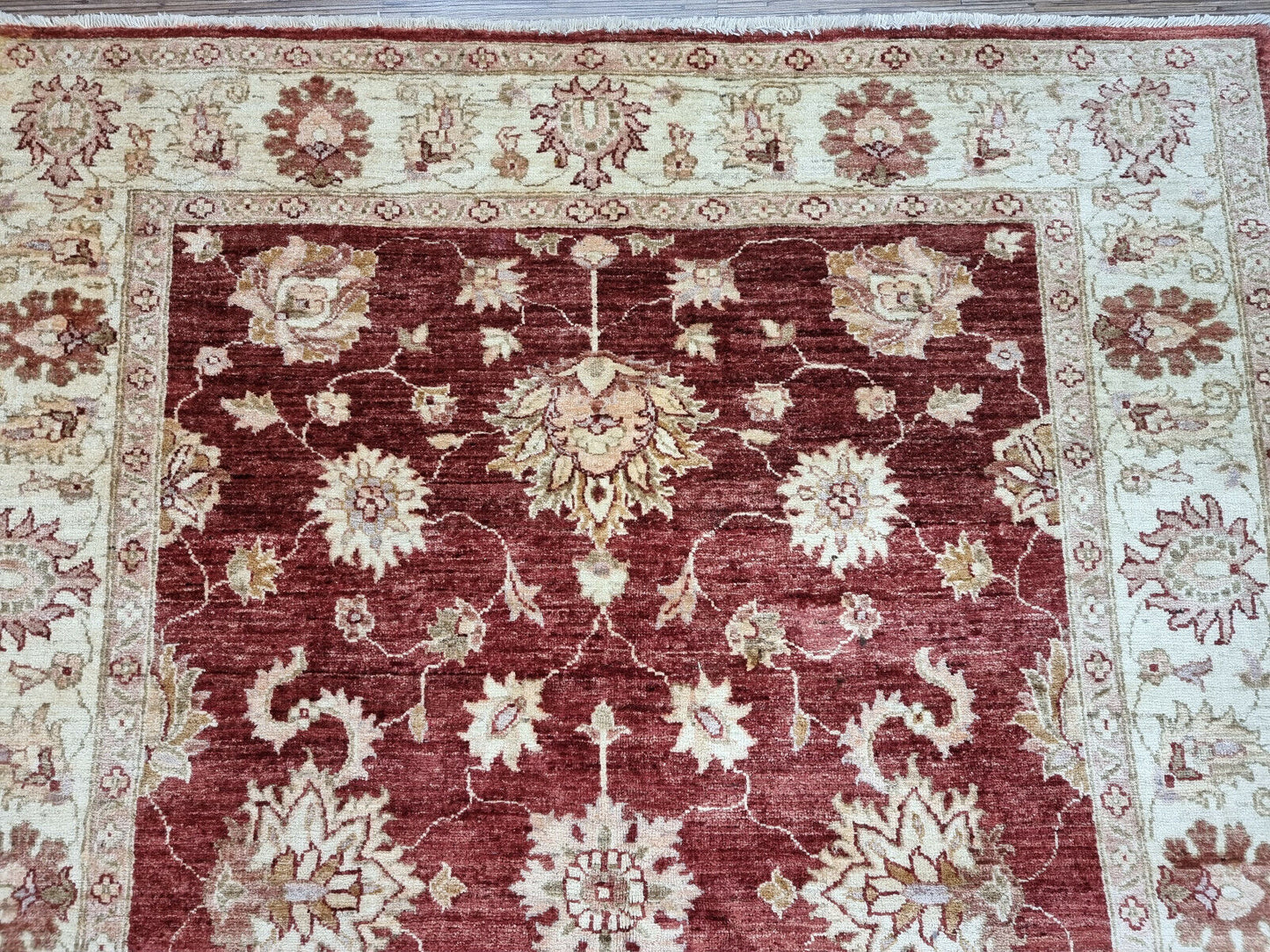 Close-up of Afghan rug-making techniques on Handmade Vintage Afghan Zigler Rug - Detailed view showcasing the traditional rug-making techniques used in creating the rug.
