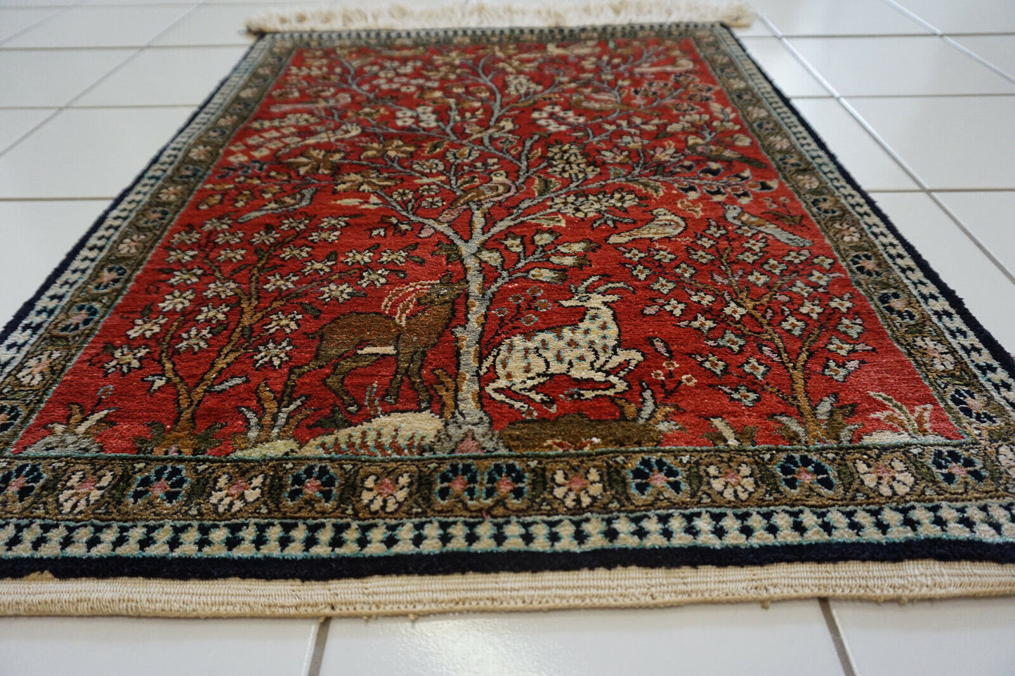 Front view of the Persian Qum silk rug enhancing the elegance of a living room