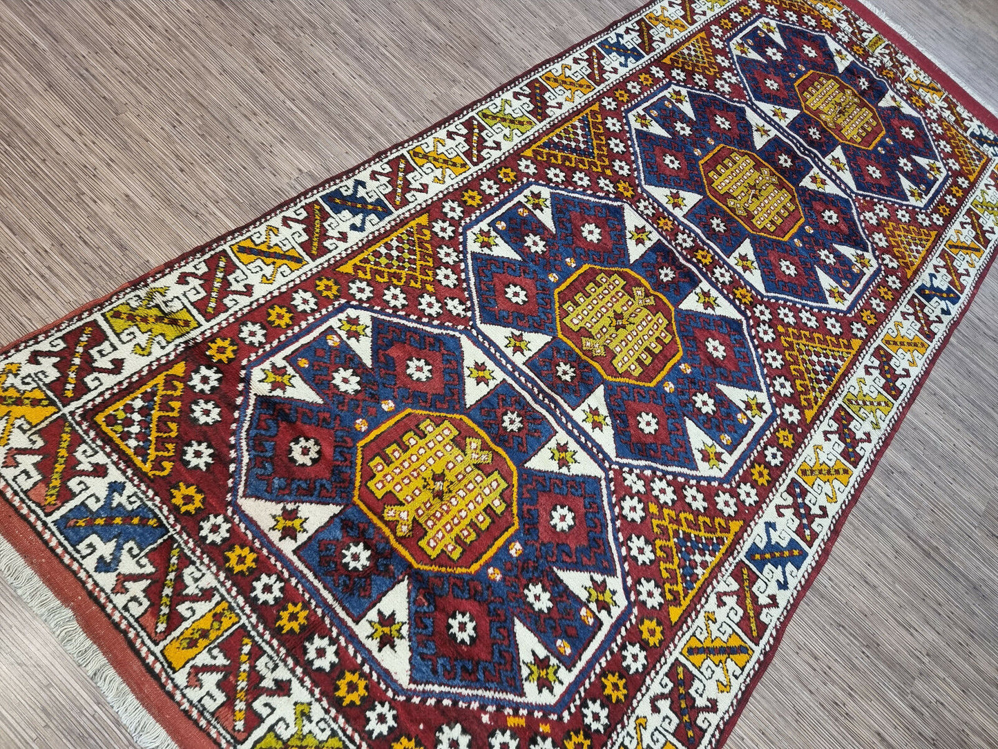 Side angle shot of the Handmade Antique Turkish Anatolian Runner Rug showcasing size and scale