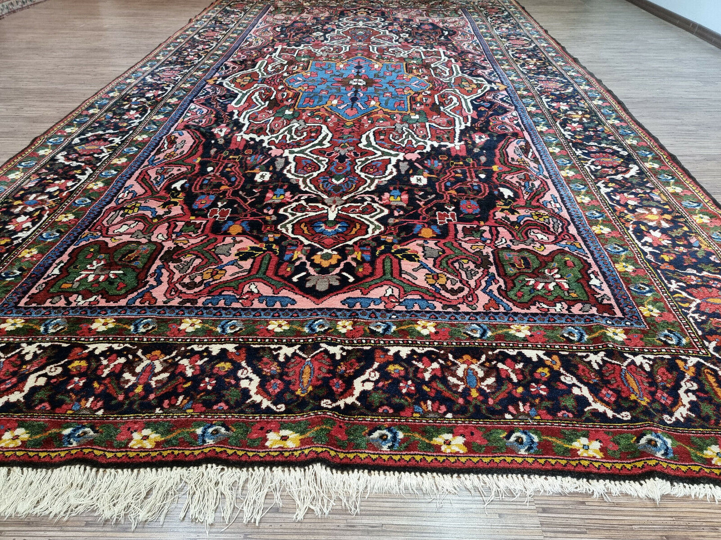 Close-up of room placement on Handmade Antique Persian Bakhtiari Rug - Detailed view showing the rug's suitability for various room settings, enhancing the décor of any space.