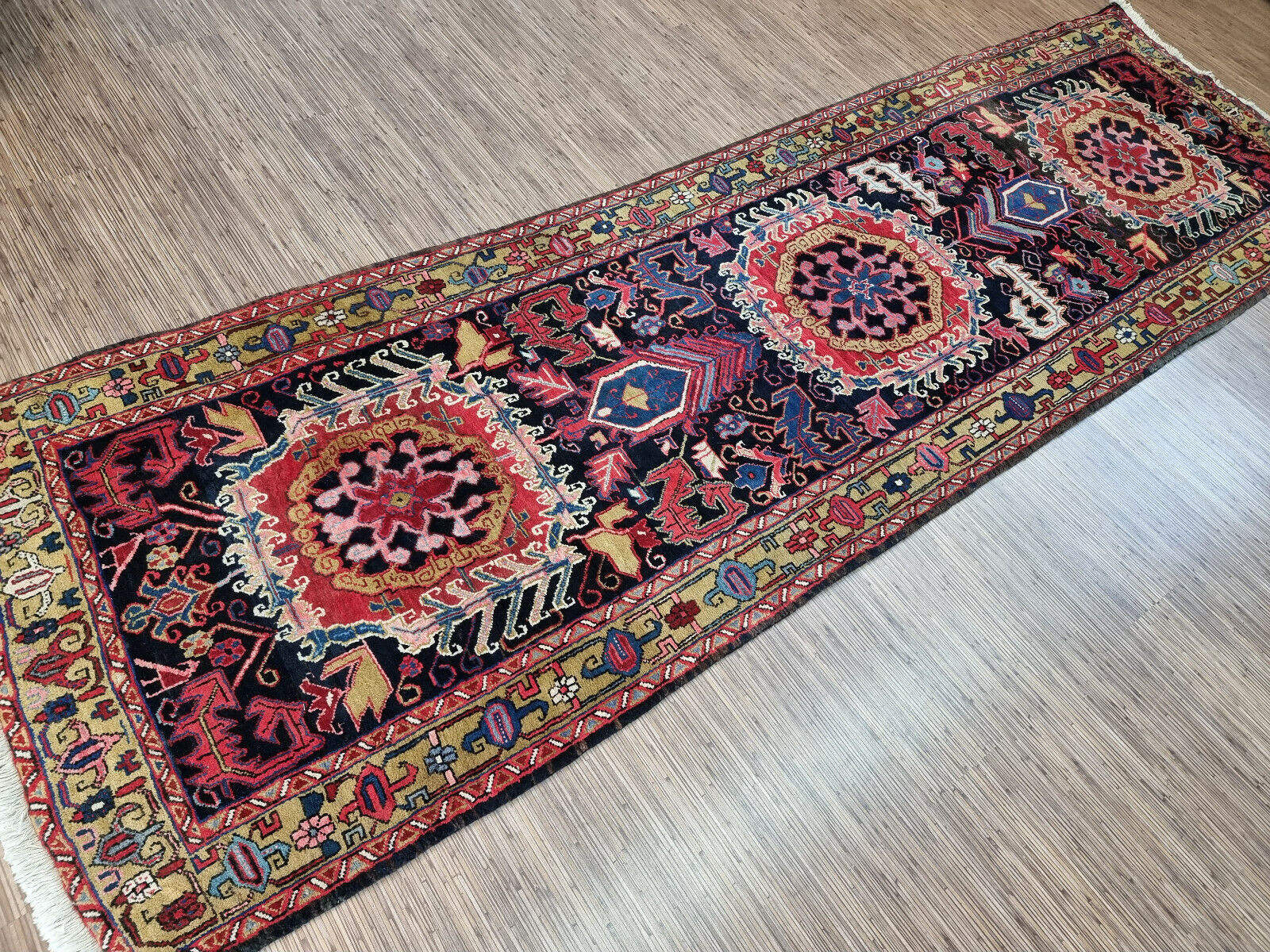 Close-up of craftsmanship on Handmade Antique Persian Heriz Runner Rug - Detailed view showcasing the craftsmanship involved in creating the rug's intricate pattern.