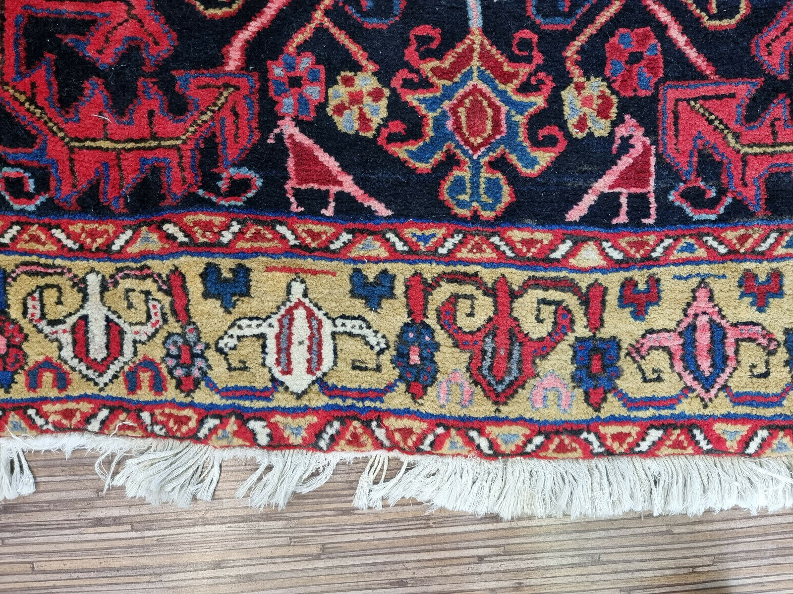 Close-up of floral motifs on Handmade Antique Persian Heriz Runner Rug - Detailed view highlighting the intricate floral motifs integrated into the rug's pattern.