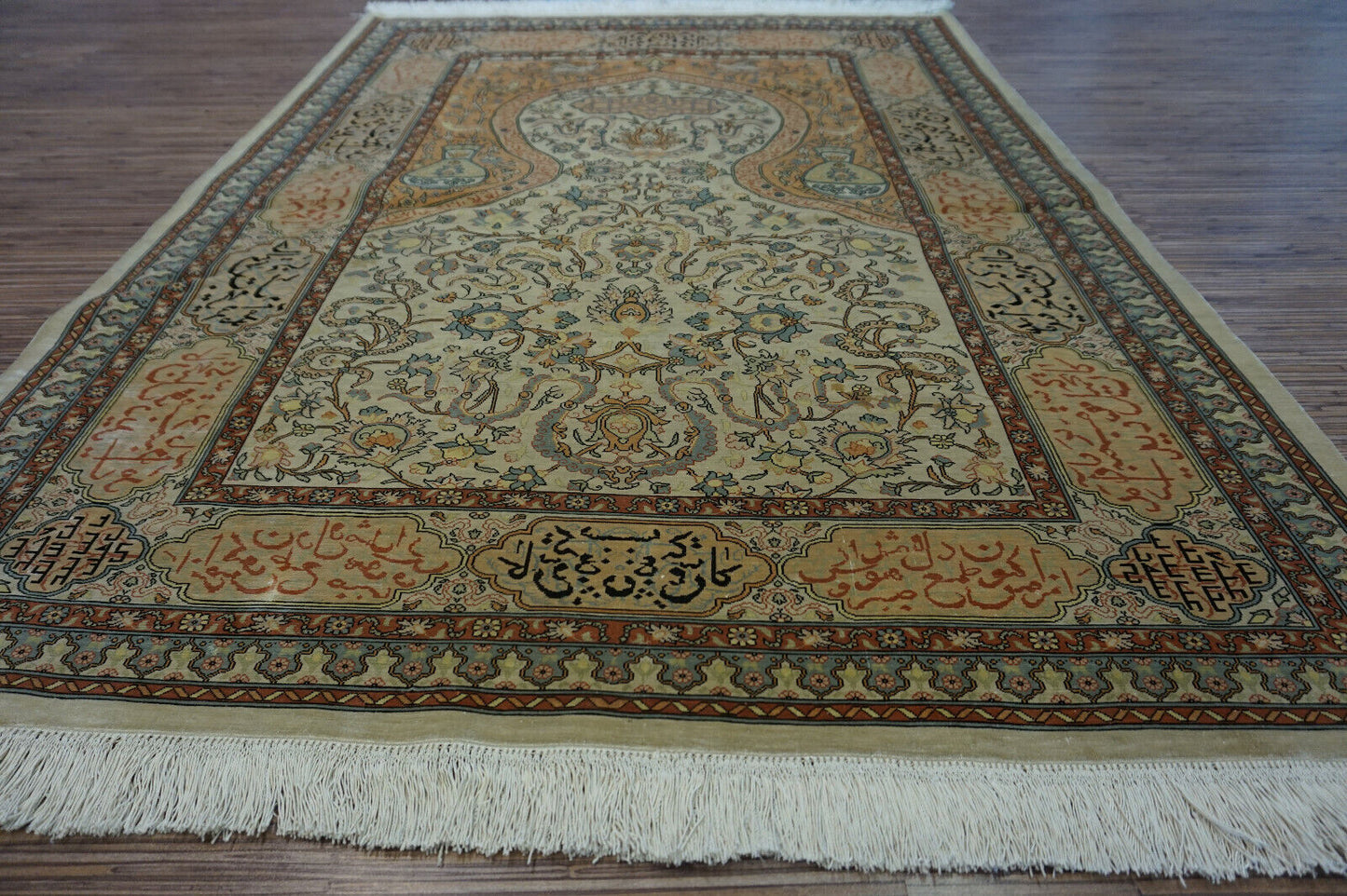Angled shot of the Handmade Vintage Turkish Hereke Silk Rug complementing furniture