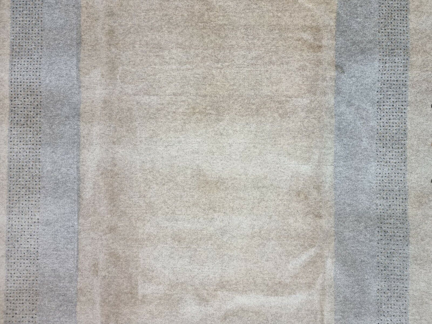 Close-up of the irregular beauty and dark spots on the Handmade Vintage Persian Style Gabbeh Rug