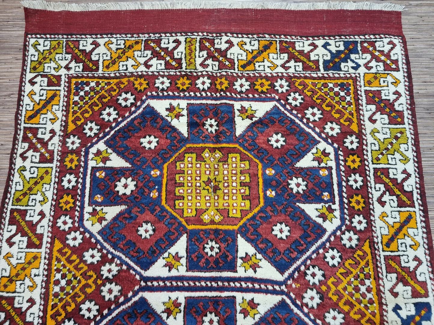 Close-up of the deep blue background on the Handmade Antique Turkish Anatolian Runner Rug