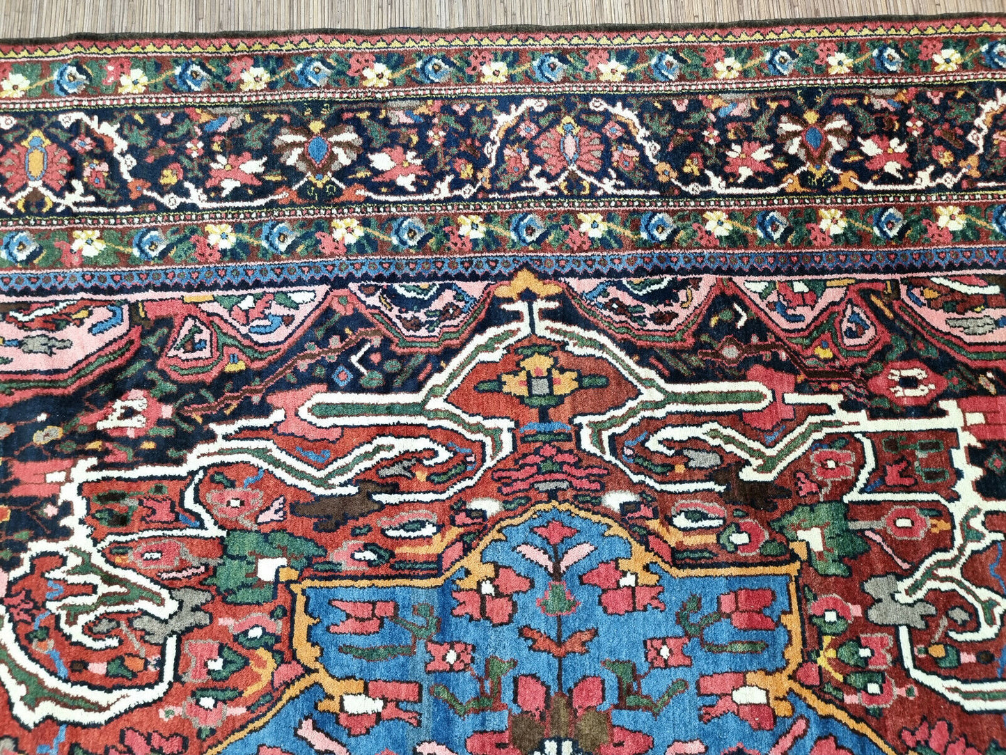 Close-up of ancient Persian craftsmanship on Handmade Antique Persian Bakhtiari Rug - Detailed view emphasizing the craftsmanship and cultural heritage reflected in the rug's design.