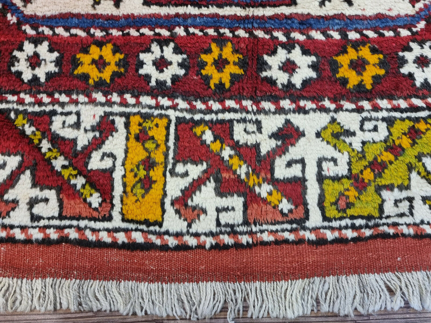 Side view of the Handmade Antique Turkish Anatolian Runner Rug demonstrating its wool material