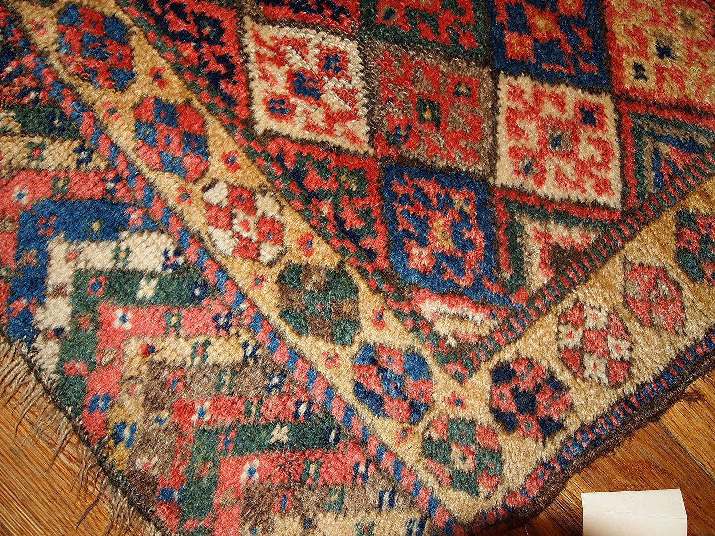 This square hand made antique collectible Persian Kurdish bag face in geometric design and in original good condition. Symmetric diamonds all around the field are in beige, blue, grey, cream and yellow colors.