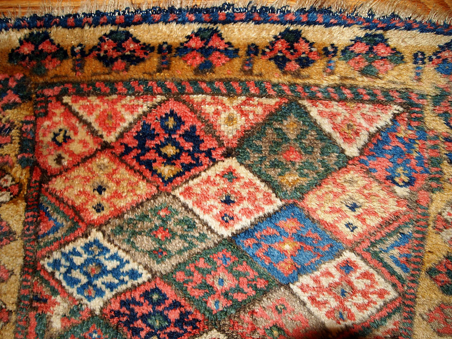 This square hand made antique collectible Persian Kurdish bag face in geometric design and in original good condition. Symmetric diamonds all around the field are in beige, blue, grey, cream and yellow colors.