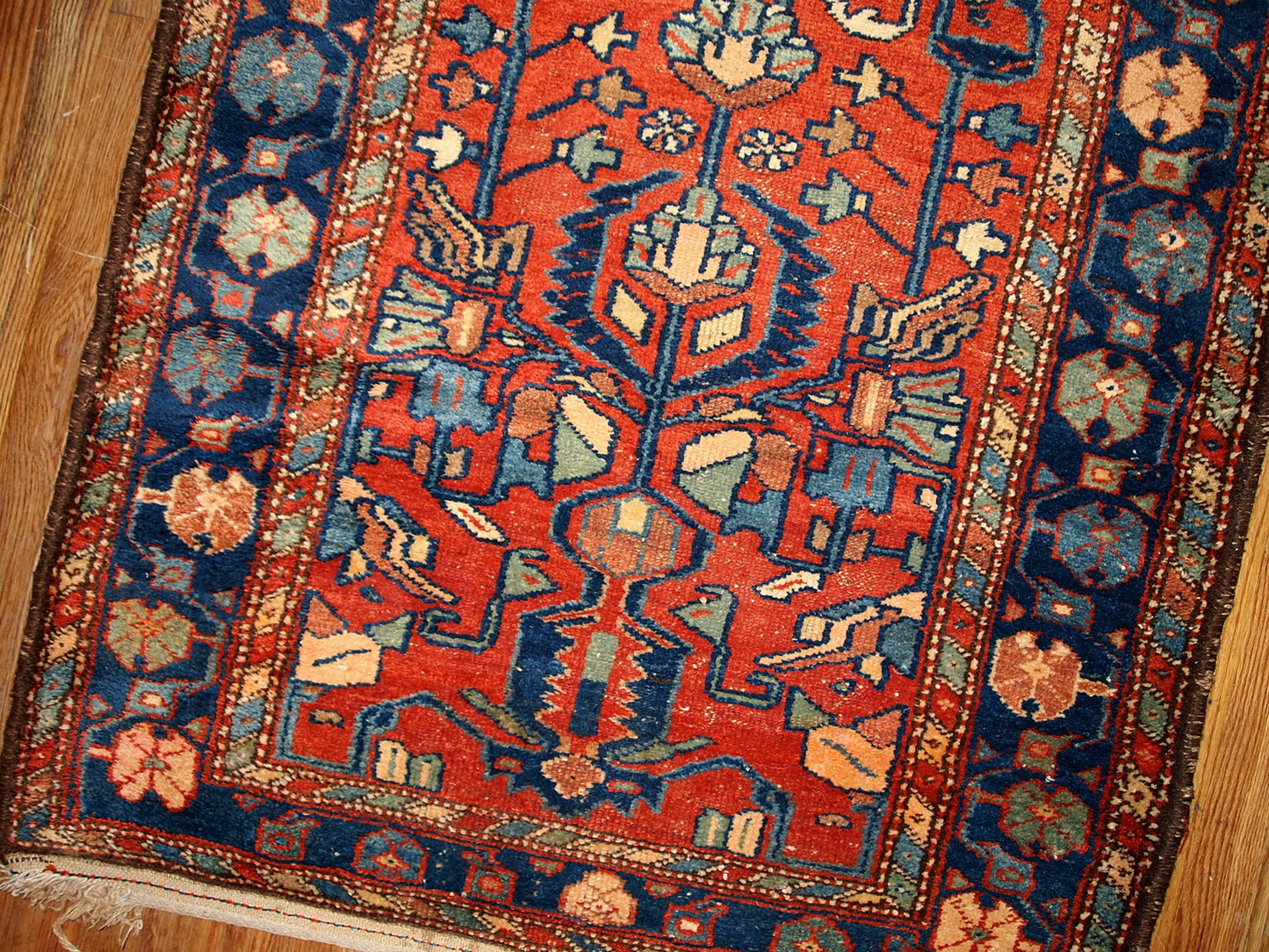 Antique Persian Lilihan rug in red and blue colors. this runner is from the beginning of 20th century in original god condition.