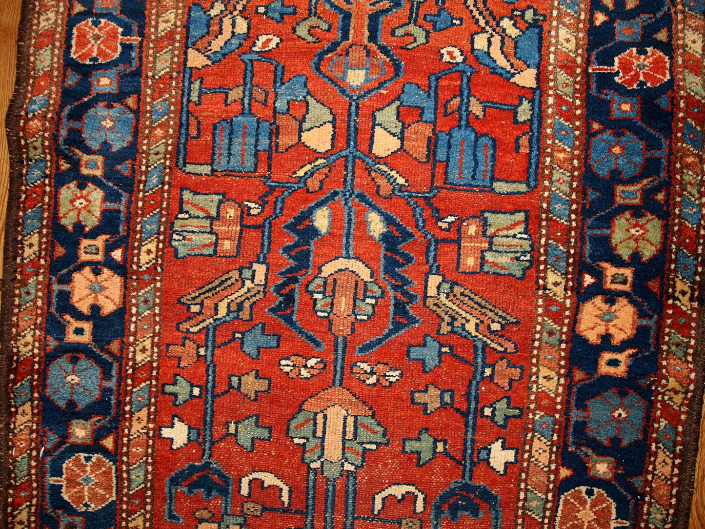 Antique Persian Lilihan rug in red and blue colors. this runner is from the beginning of 20th century in original god condition.
