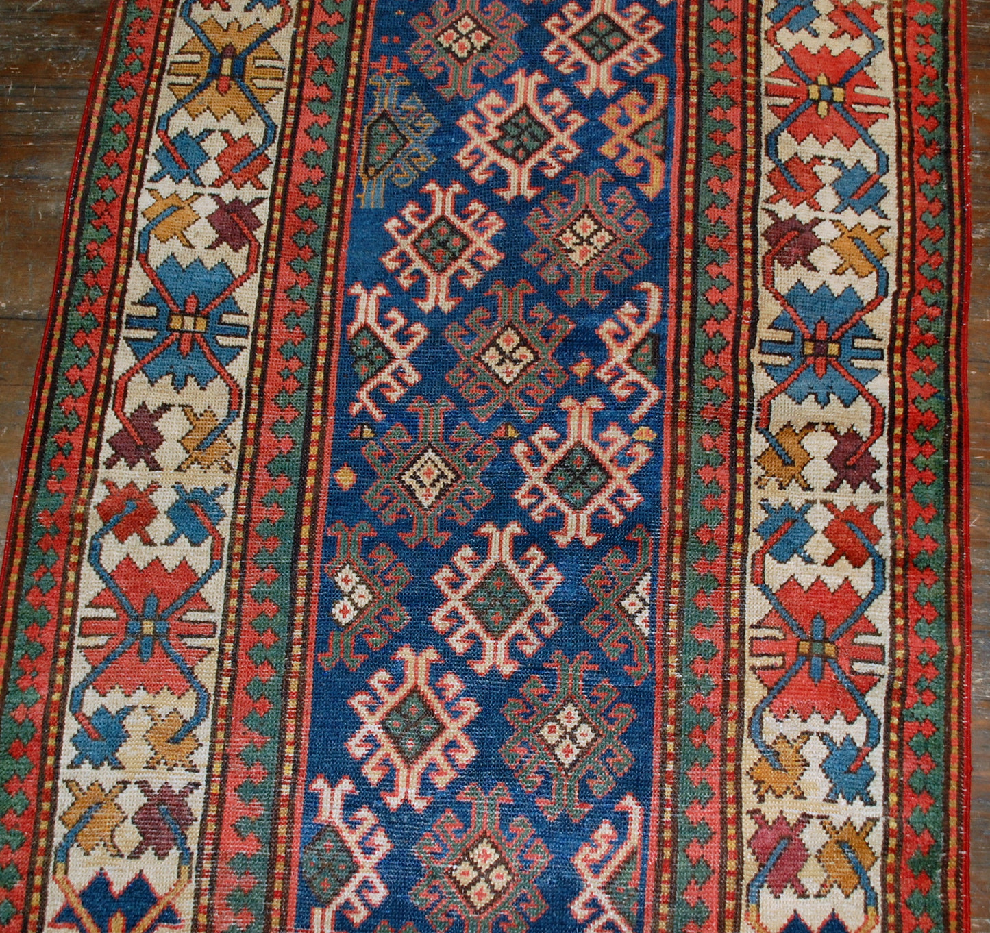 Antique handmade Caucasian Gendje rug in good condition. The rug is from the end of 19th century, made in Russia.