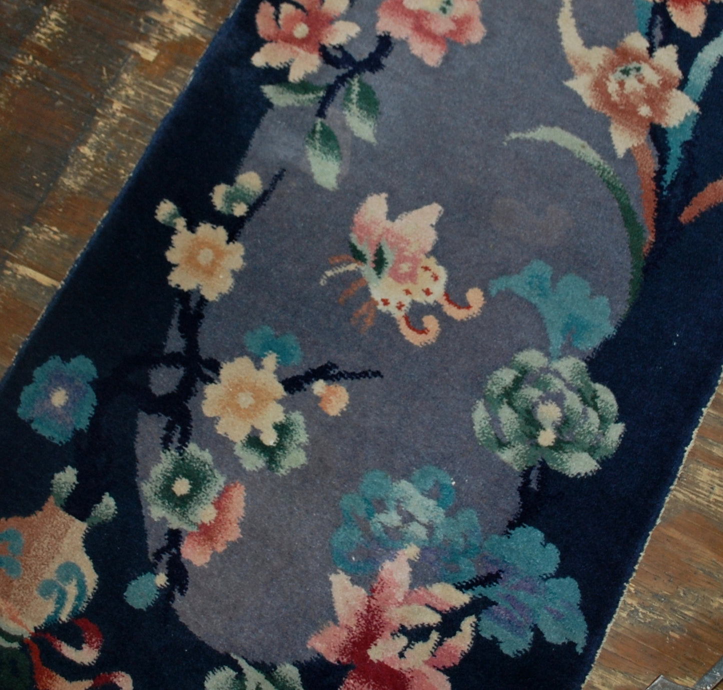 Handmade antique Art Deco Chinese rug in original good condition. It has been made in the beginning of 20th century in China.