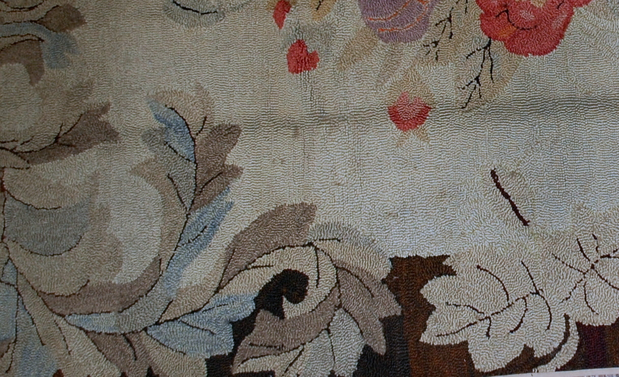 Antique decorative American hooked rug of Victorian style. The rug is in good condition, it has been made in the end of 19th century in USA.