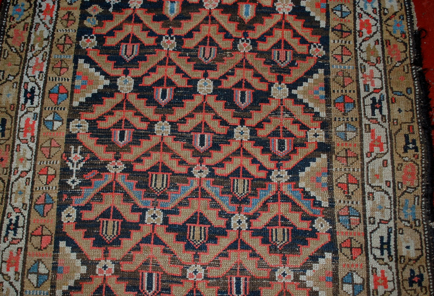 Antique Persian Hamadan rug in original condition, it has some low pile. The rug is from the Middle East region made in the beginning of 20th century.