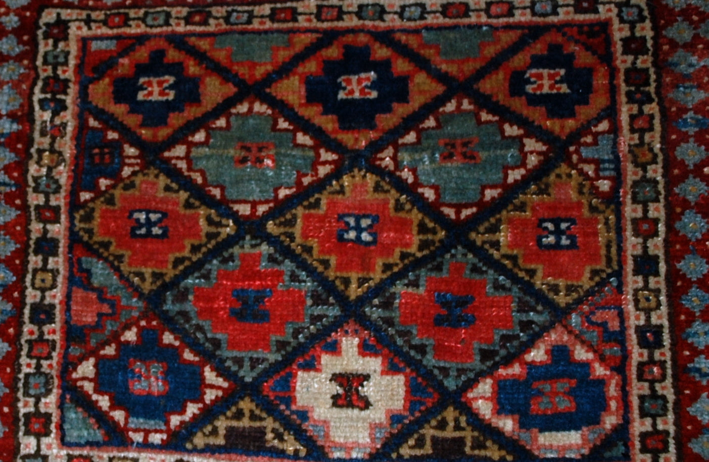 Hand made antique collectible Kurdish bag face in geometric design with colorful background and geometric design . Very interesting border sky blue border with burgundy accent on it. The bag face is in original good condition.