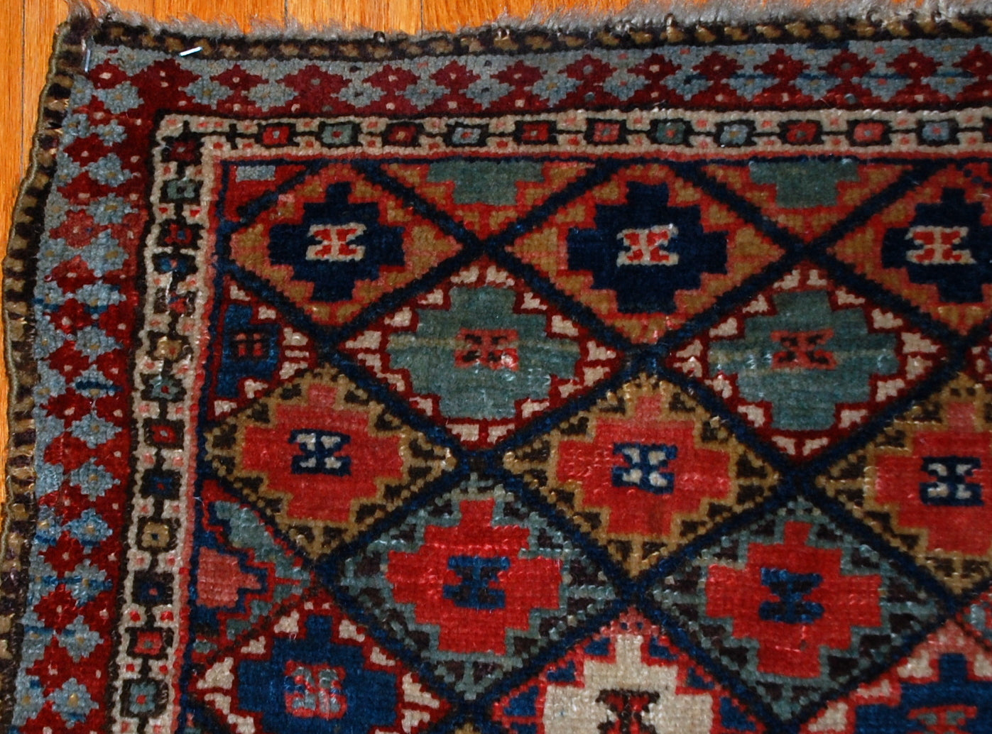 Hand made antique collectible Kurdish bag face in geometric design with colorful background and geometric design . Very interesting border sky blue border with burgundy accent on it. The bag face is in original good condition.