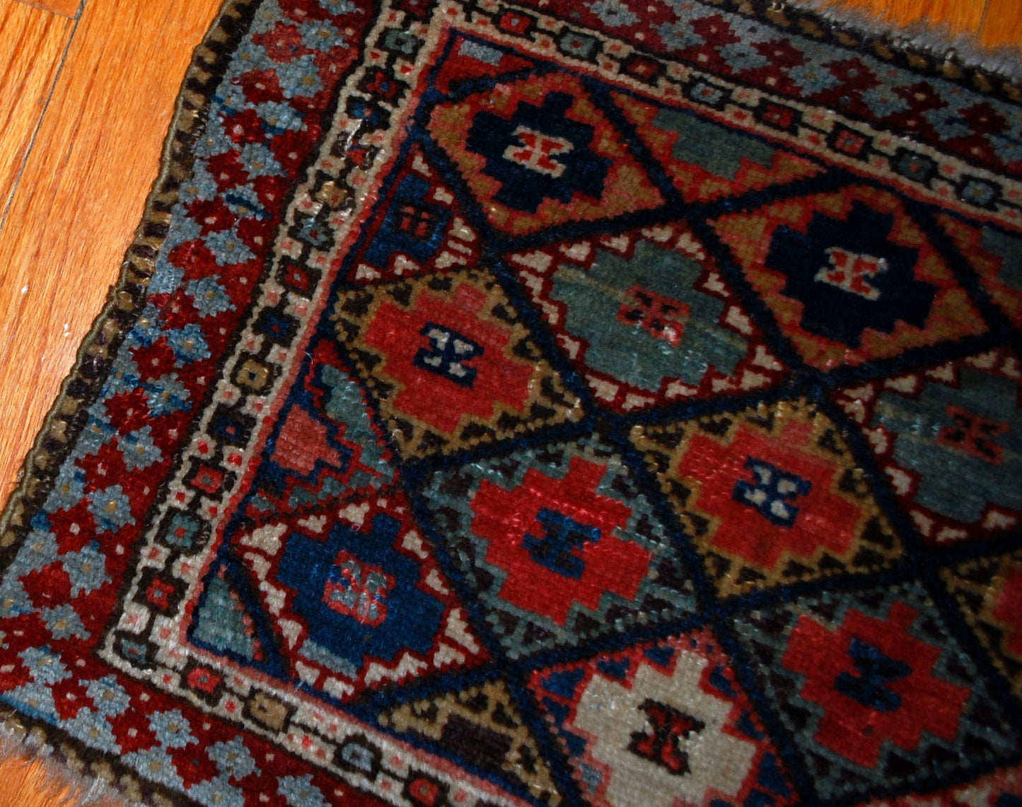 Hand made antique collectible Kurdish bag face in geometric design with colorful background and geometric design . Very interesting border sky blue border with burgundy accent on it. The bag face is in original good condition.