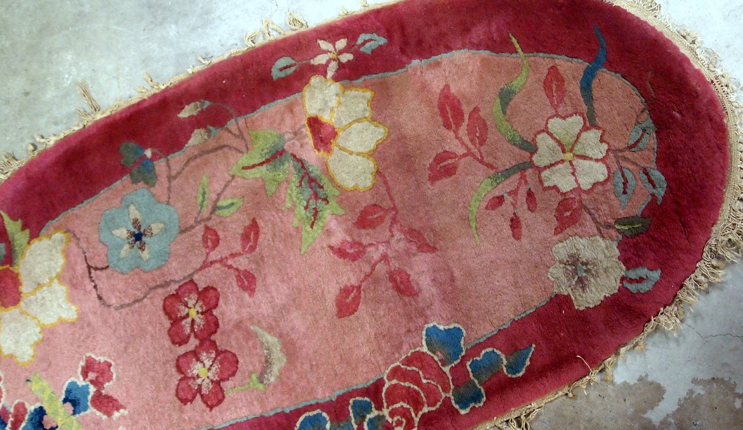 Oval Art Deco Chinese rug in original good condition. the rug is made in wool, quite thick and soft.