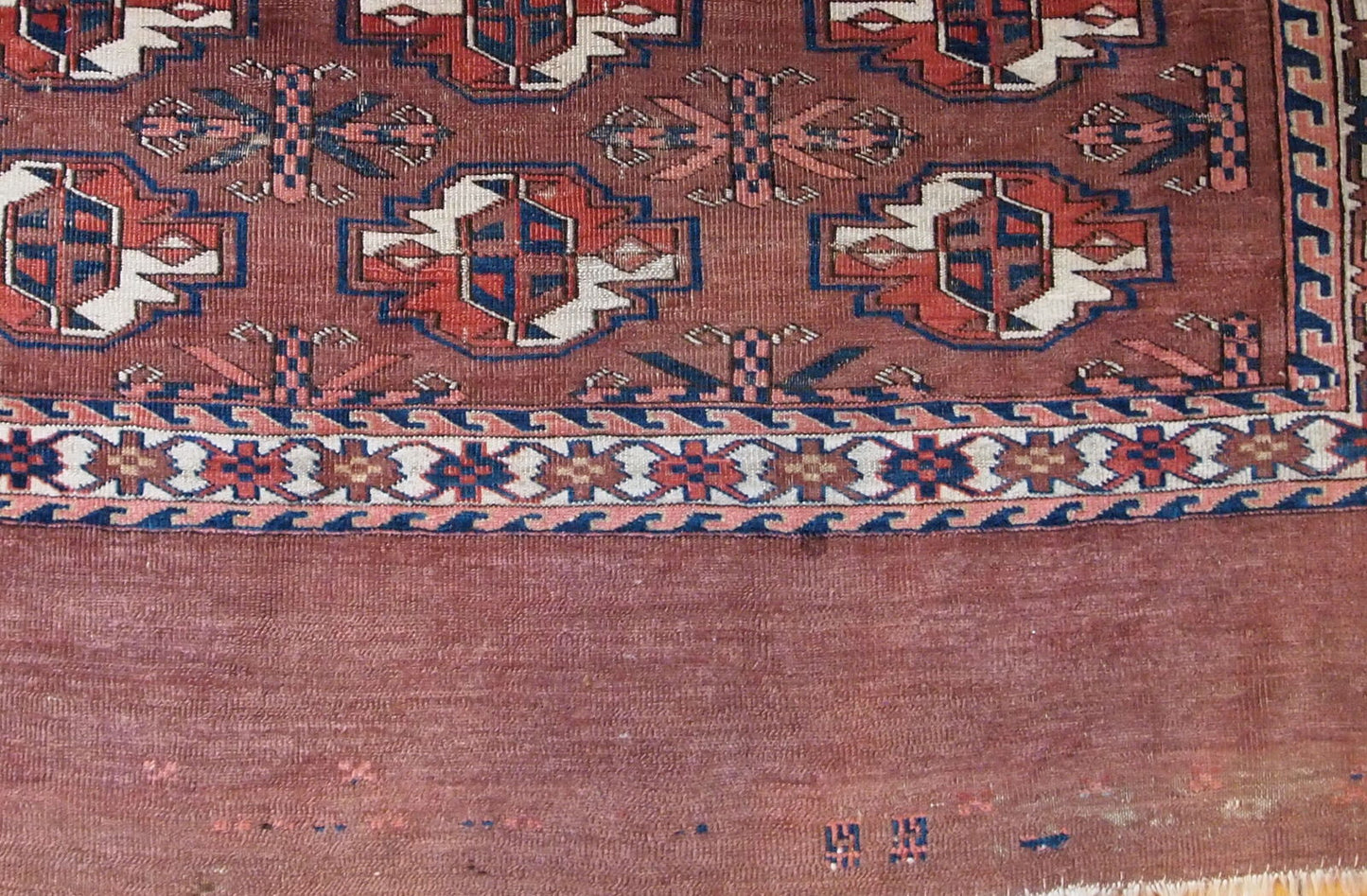 Handmade antique collectible Turkmen Yomud rug in original condition with some signs of age.