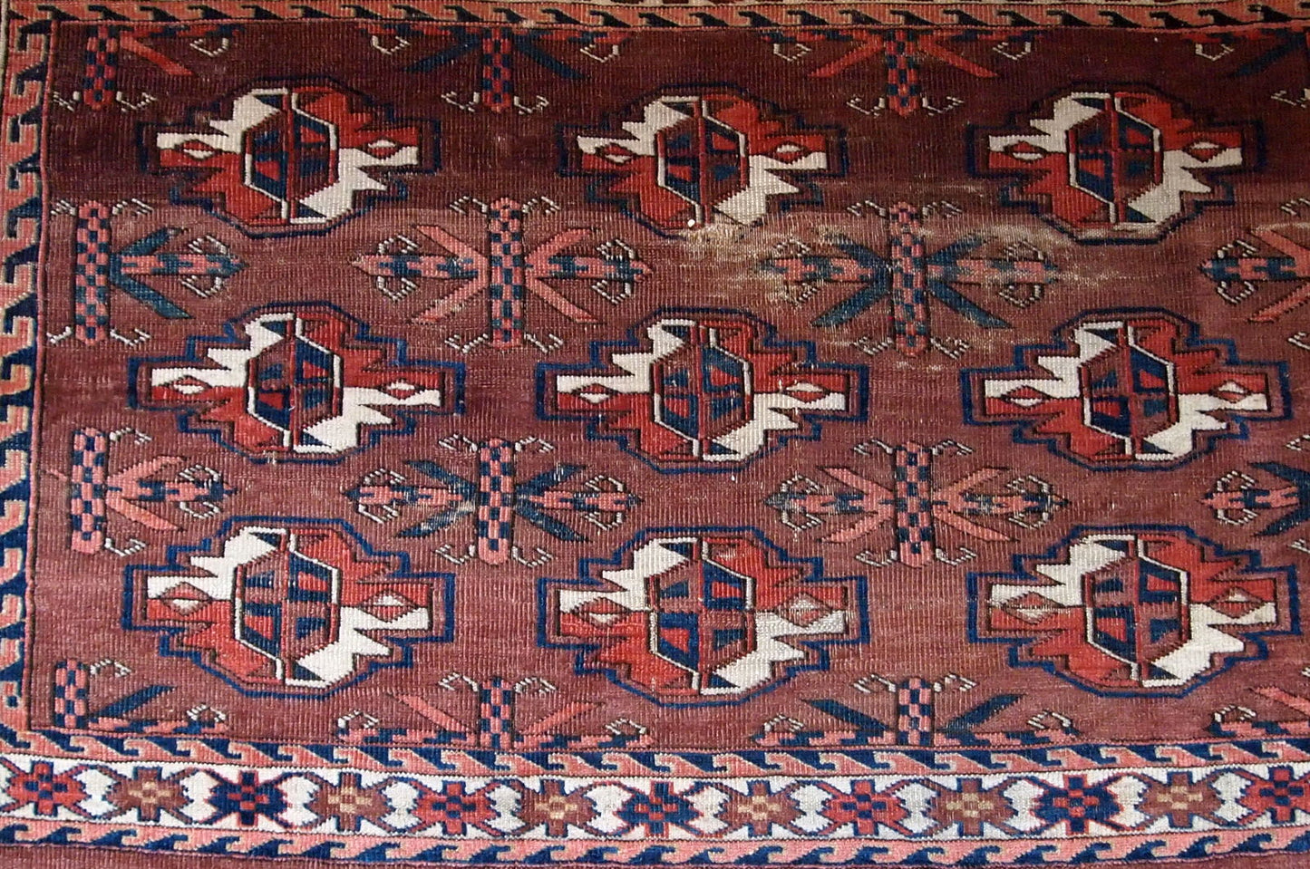 Handmade antique collectible Turkmen Yomud rug in original condition with some signs of age.
