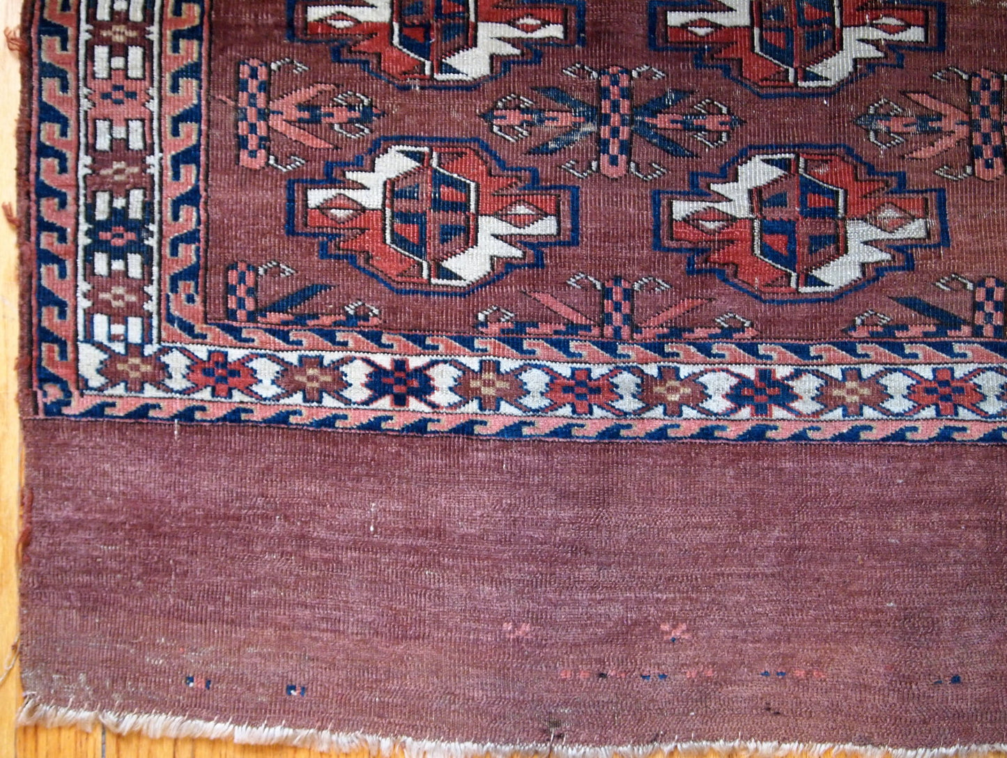 Handmade antique collectible Turkmen Yomud rug in original condition with some signs of age.