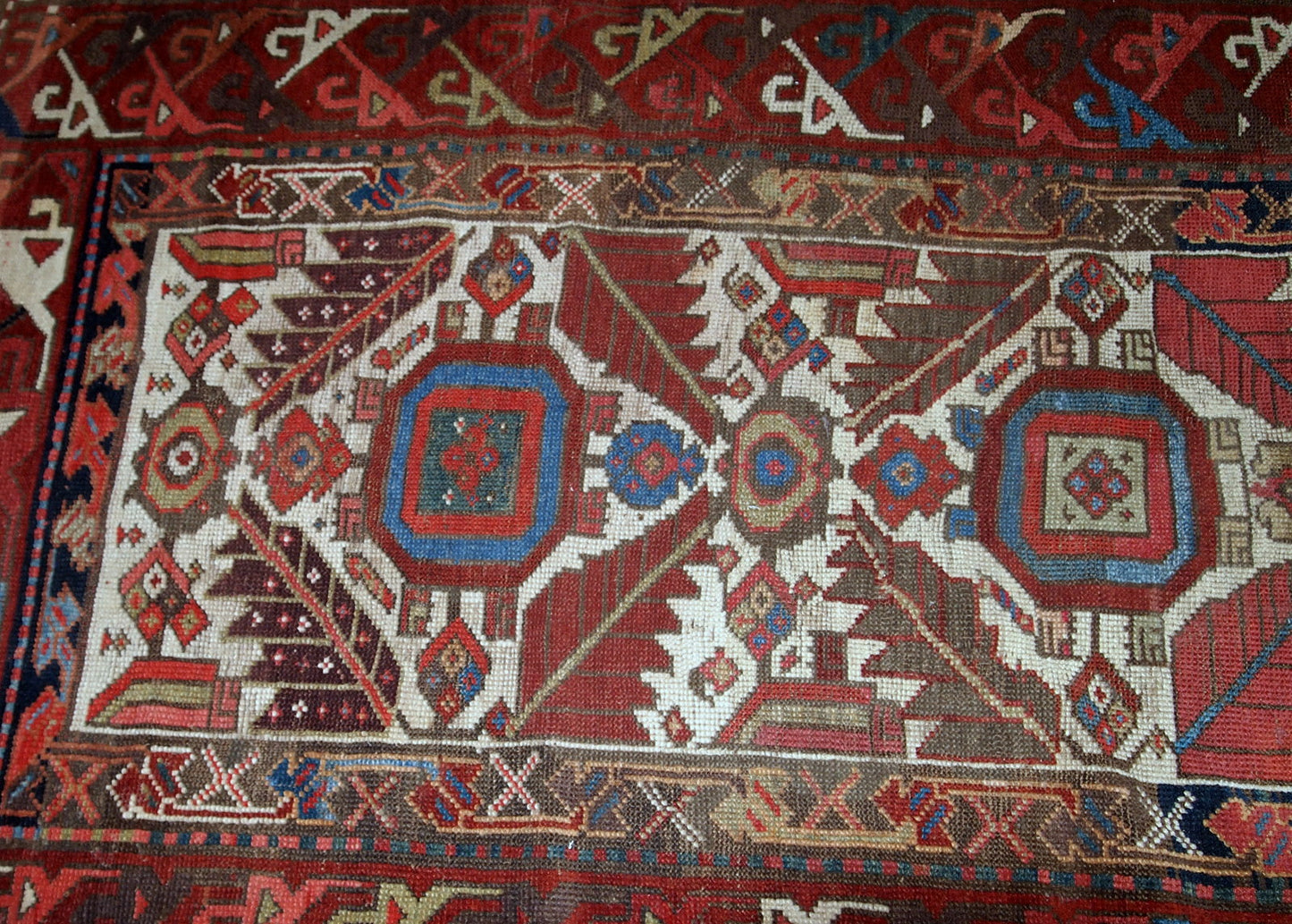Hand made antique collectible Northwest Persian runner in original good condition. This rug is from the middle of 19th century in white, burgundy, blue and yellow shades.