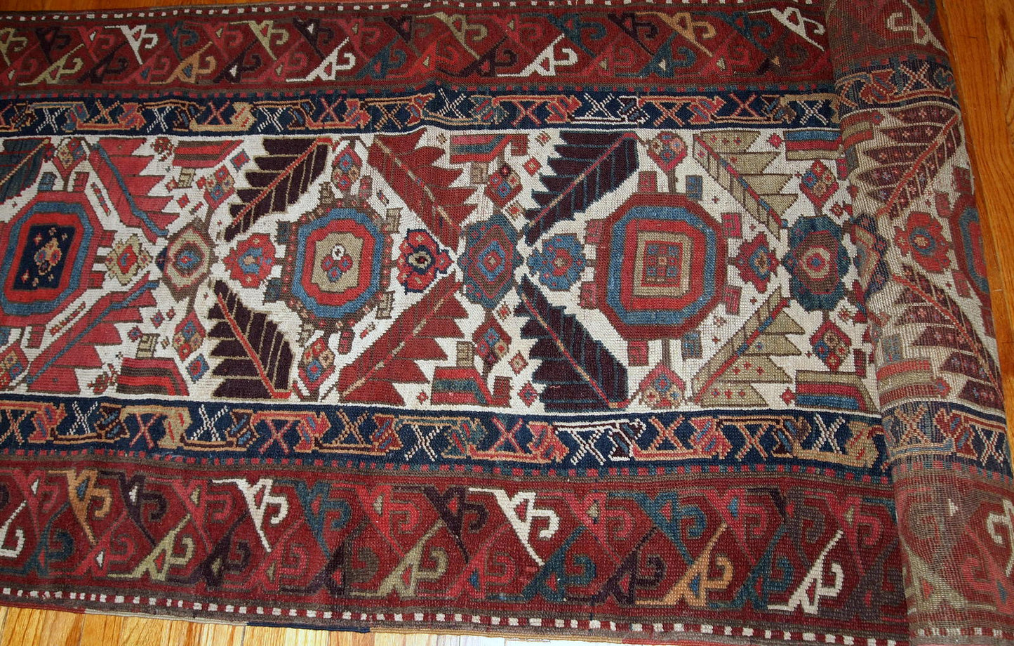 Hand made antique collectible Northwest Persian runner in original good condition. This rug is from the middle of 19th century in white, burgundy, blue and yellow shades.